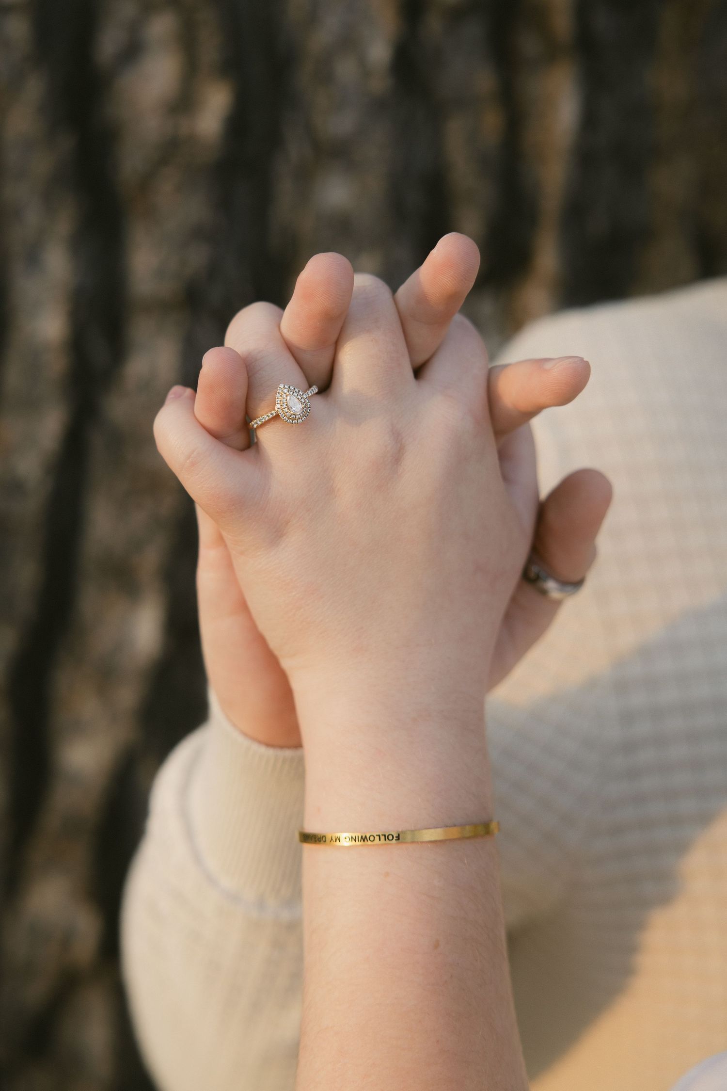 Close-up photos of hands wearing gold rings and bracelets in soft natural lighting.