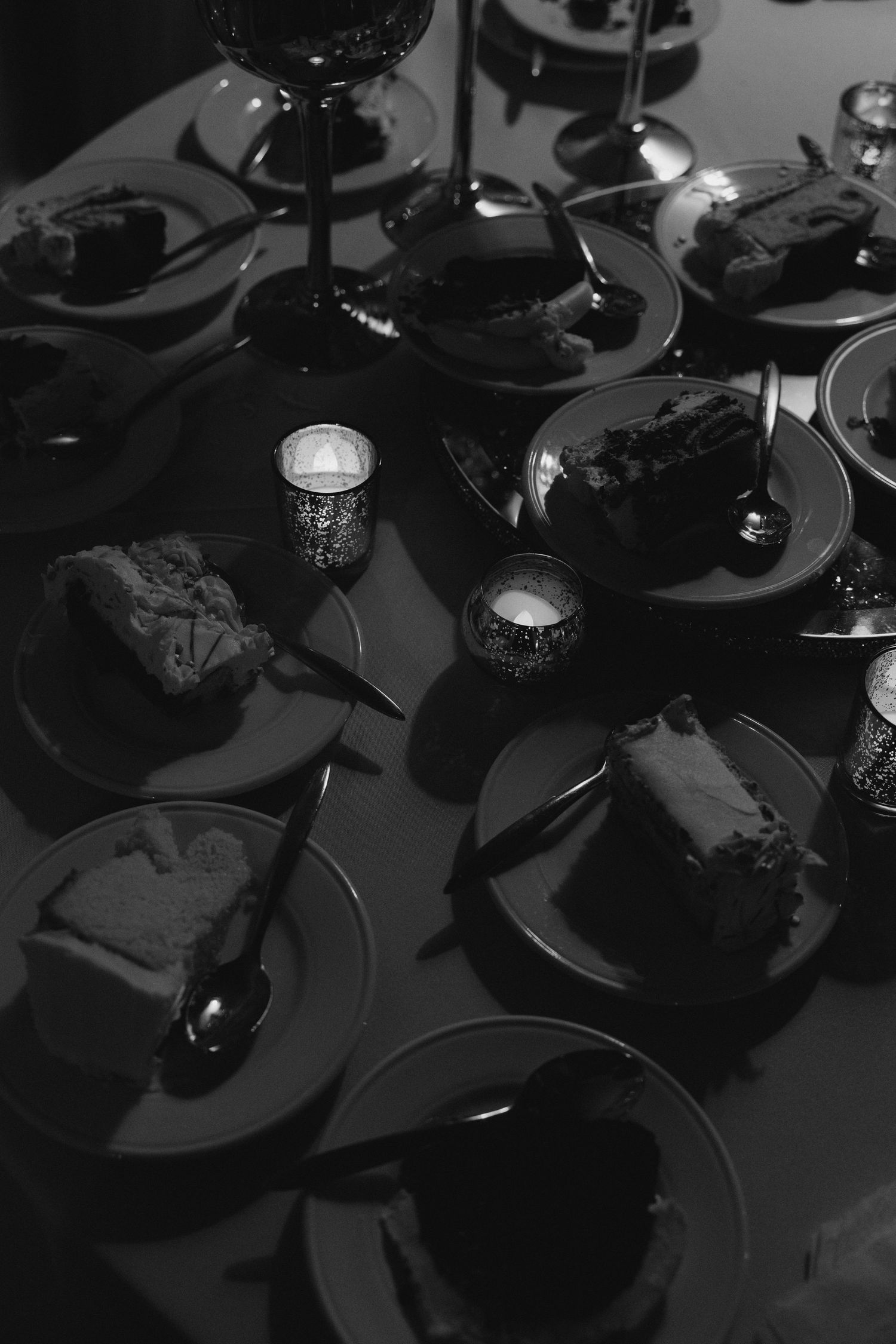 Black vinyl records arranged in a dark moody composition with dramatic lighting.