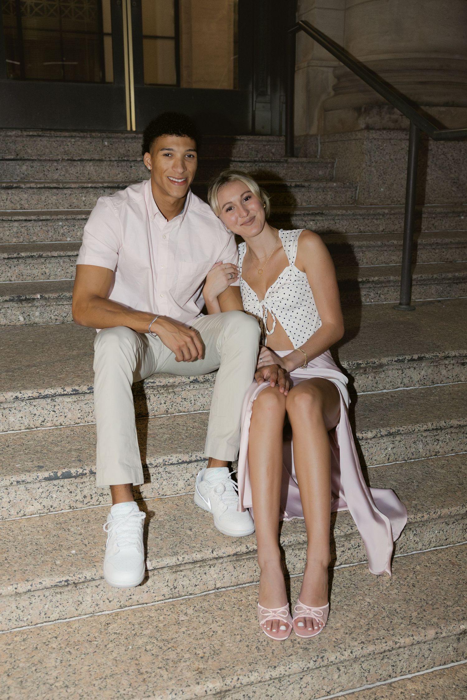 A couple sits together on stone steps in casual summer outfits creating a romantic moment in three similar poses.