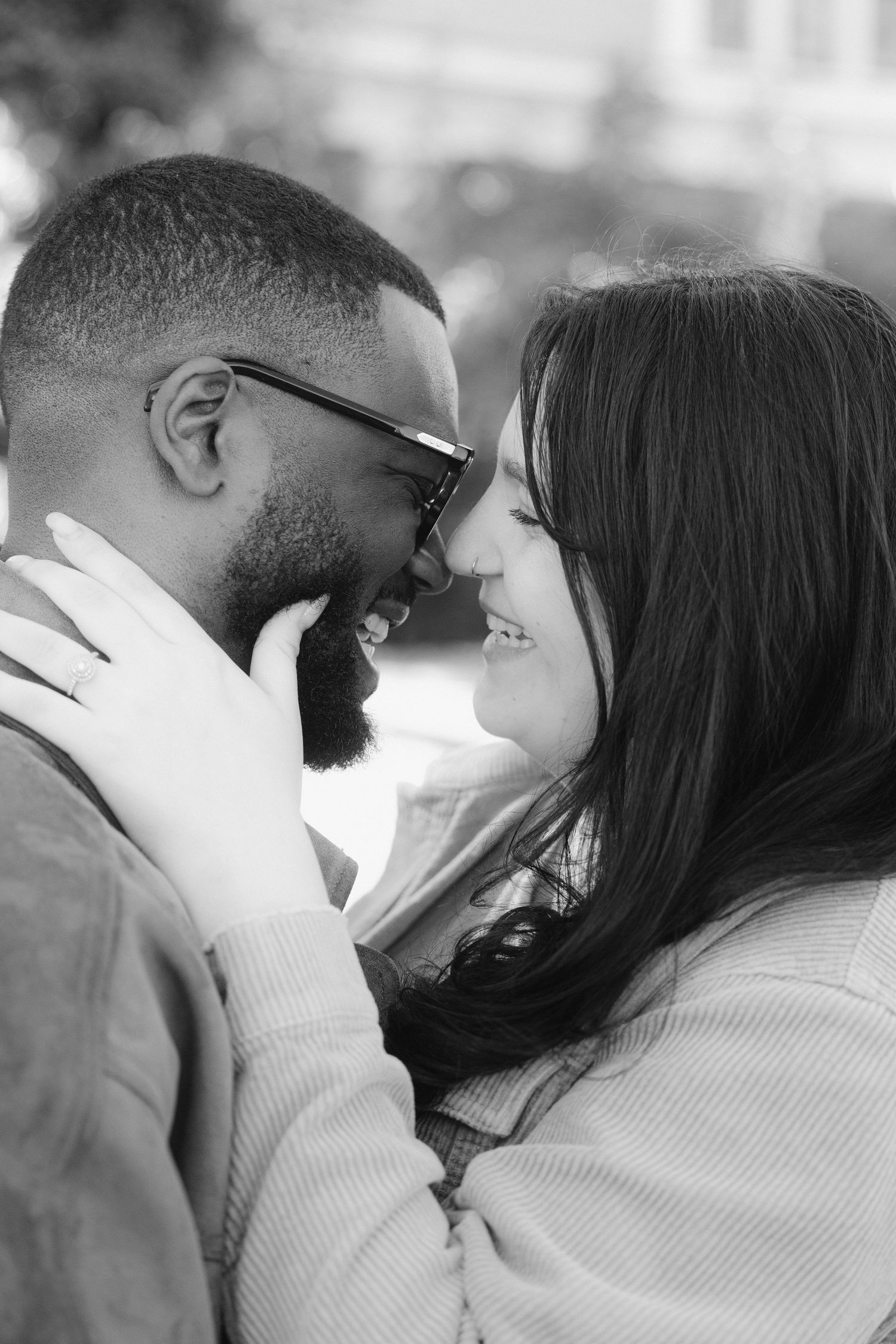 A romantic black and white photo series showing an intimate couple sharing tender moments together.