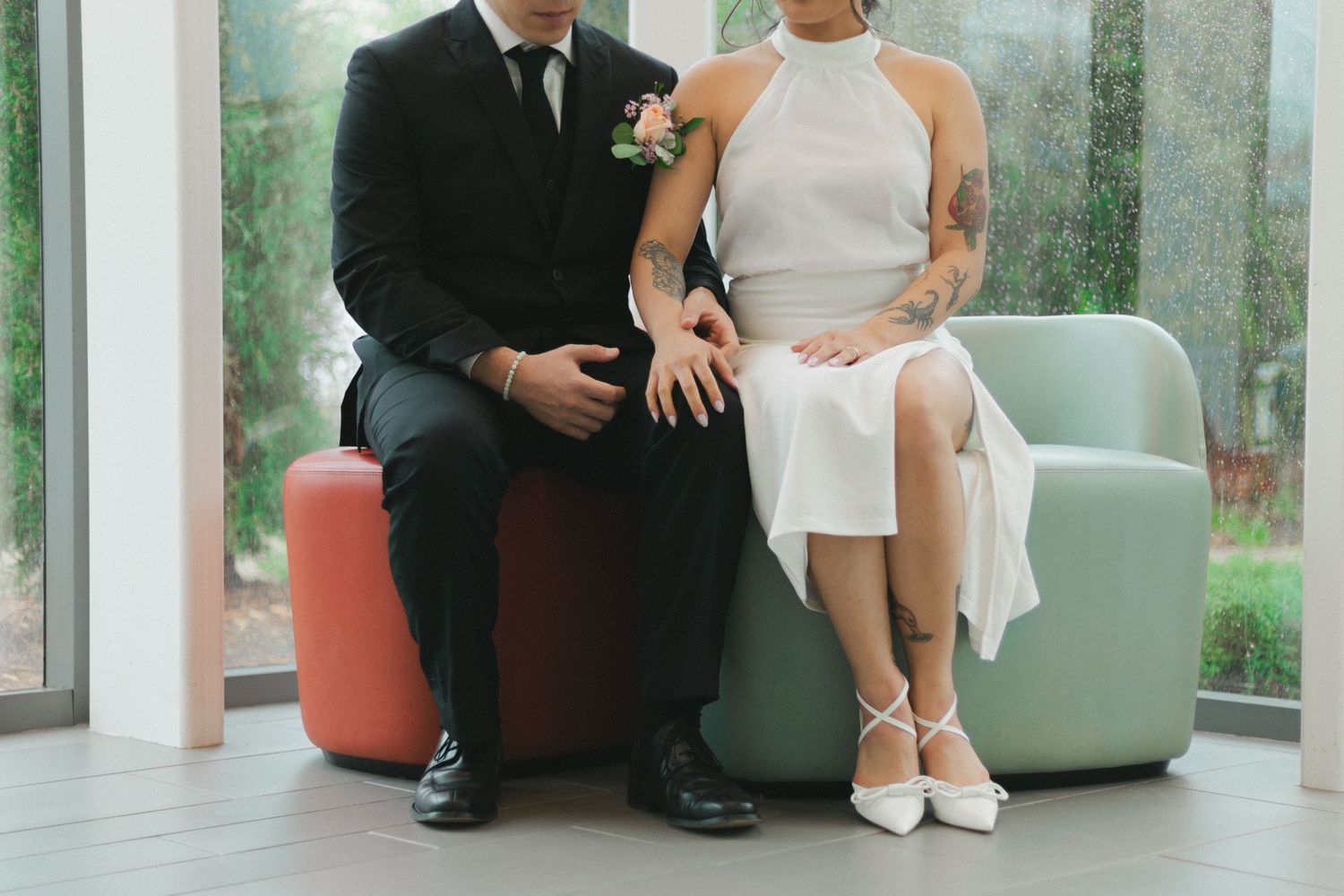 Minimalist wedding portrait showing details of formal attire and footwear.