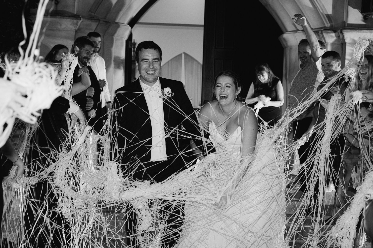 A series of black and white photographs showing people dancing and celebrating at what appears to be a party or celebration.