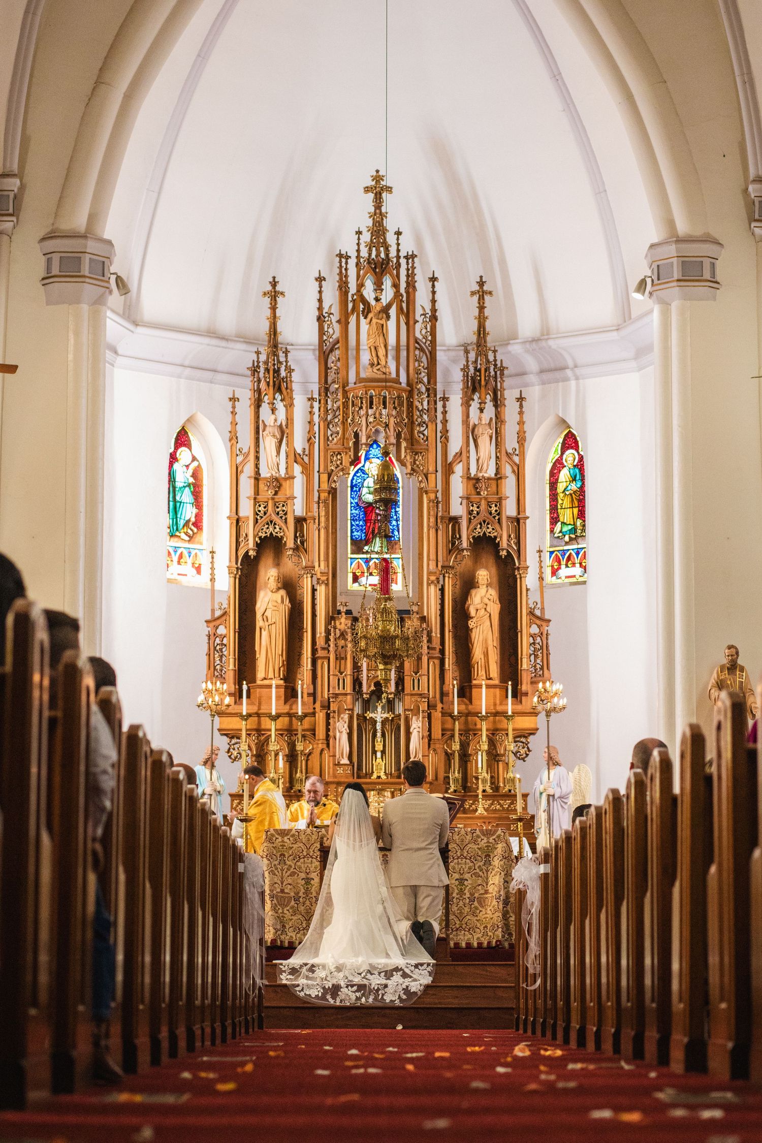 Panoramic sequence of a traditional church wedding ceremony showing ornate gothic altar and stained glass windows.