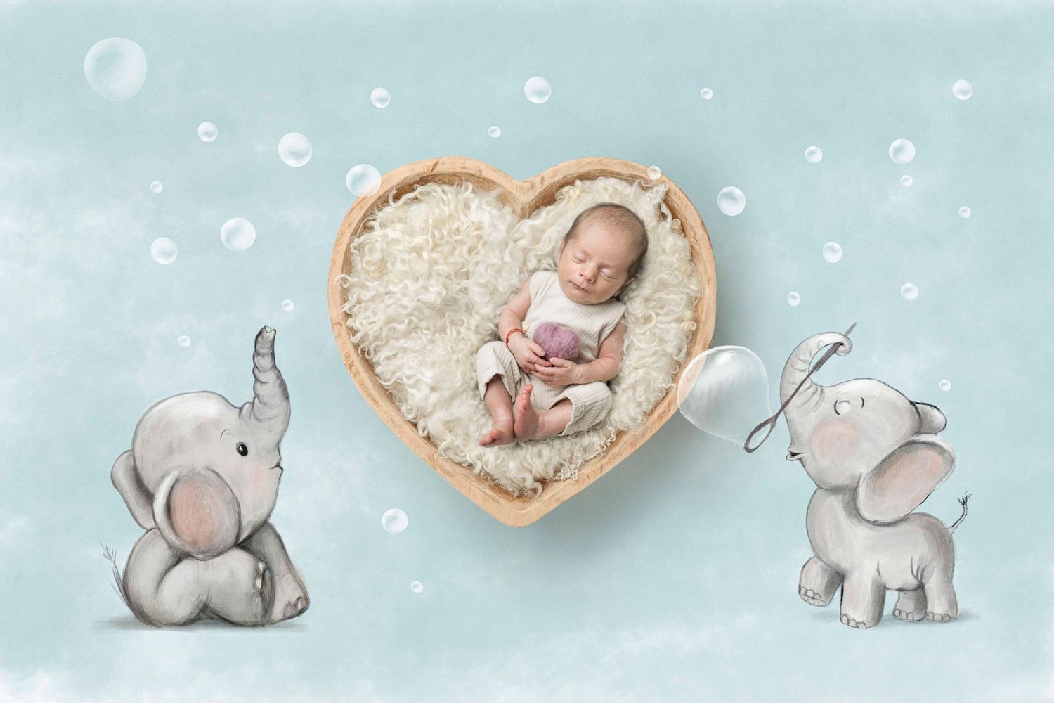 Newborn baby sleeping in heart-shaped wooden bowl surrounded by illustrated elephants on soft blue background.