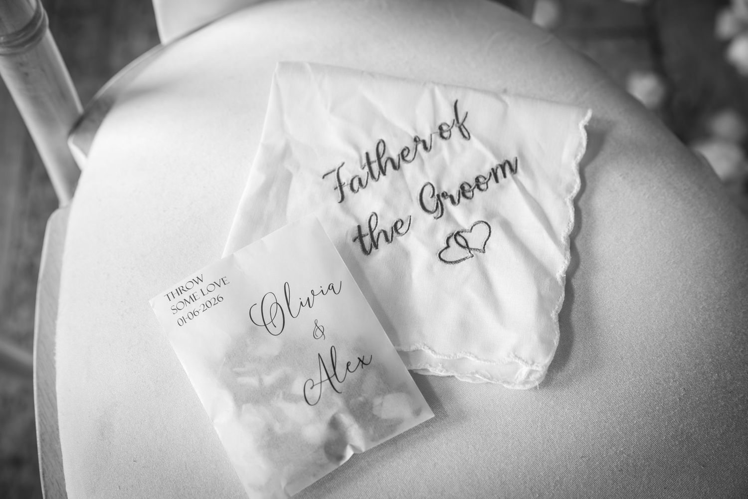 Black and white photo of Father of the Groom handkerchief and wedding favor bag for Oliva and Alex.