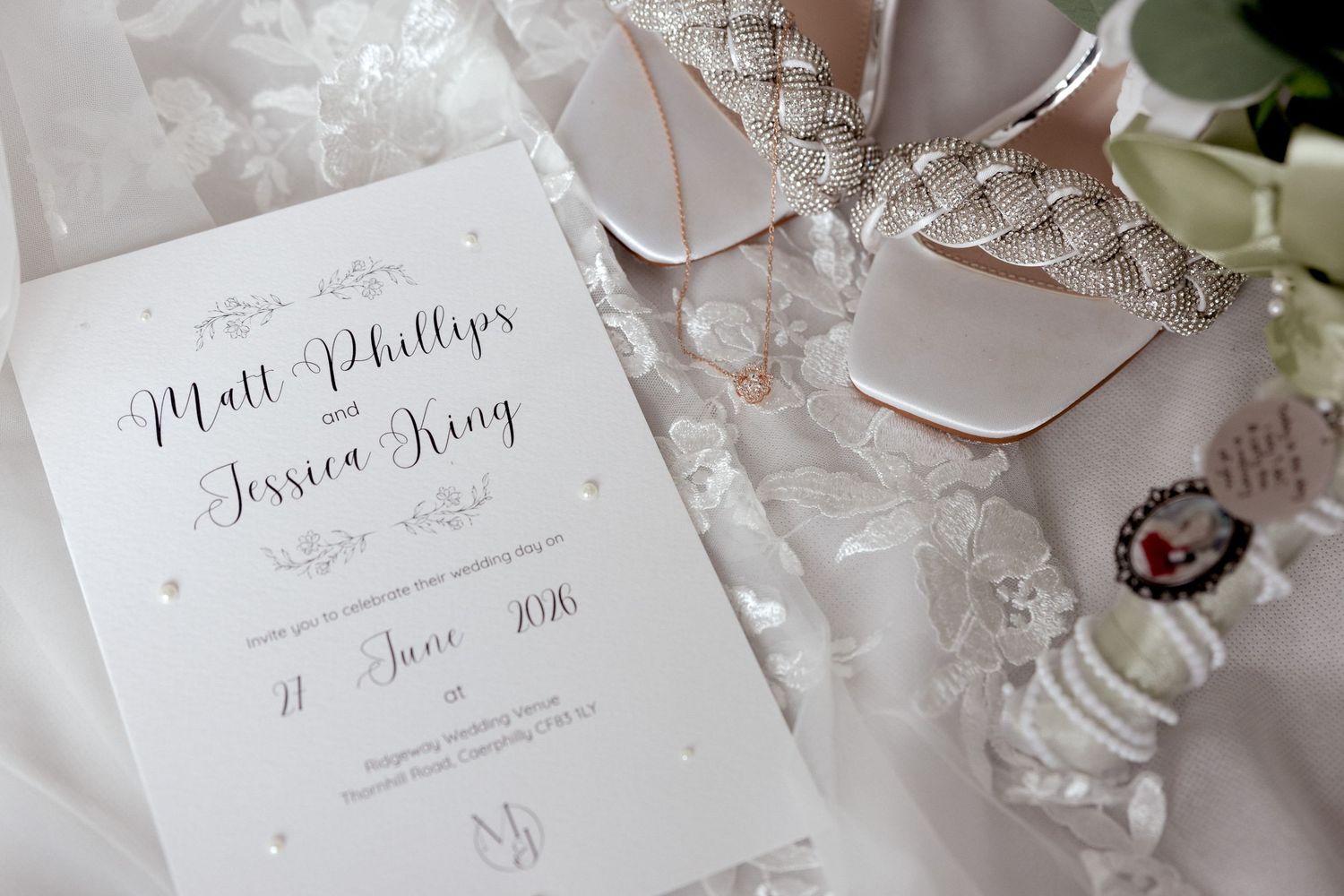 Matt Phillips and Jessica Irving wedding invitation with bridal shoes and accessories.