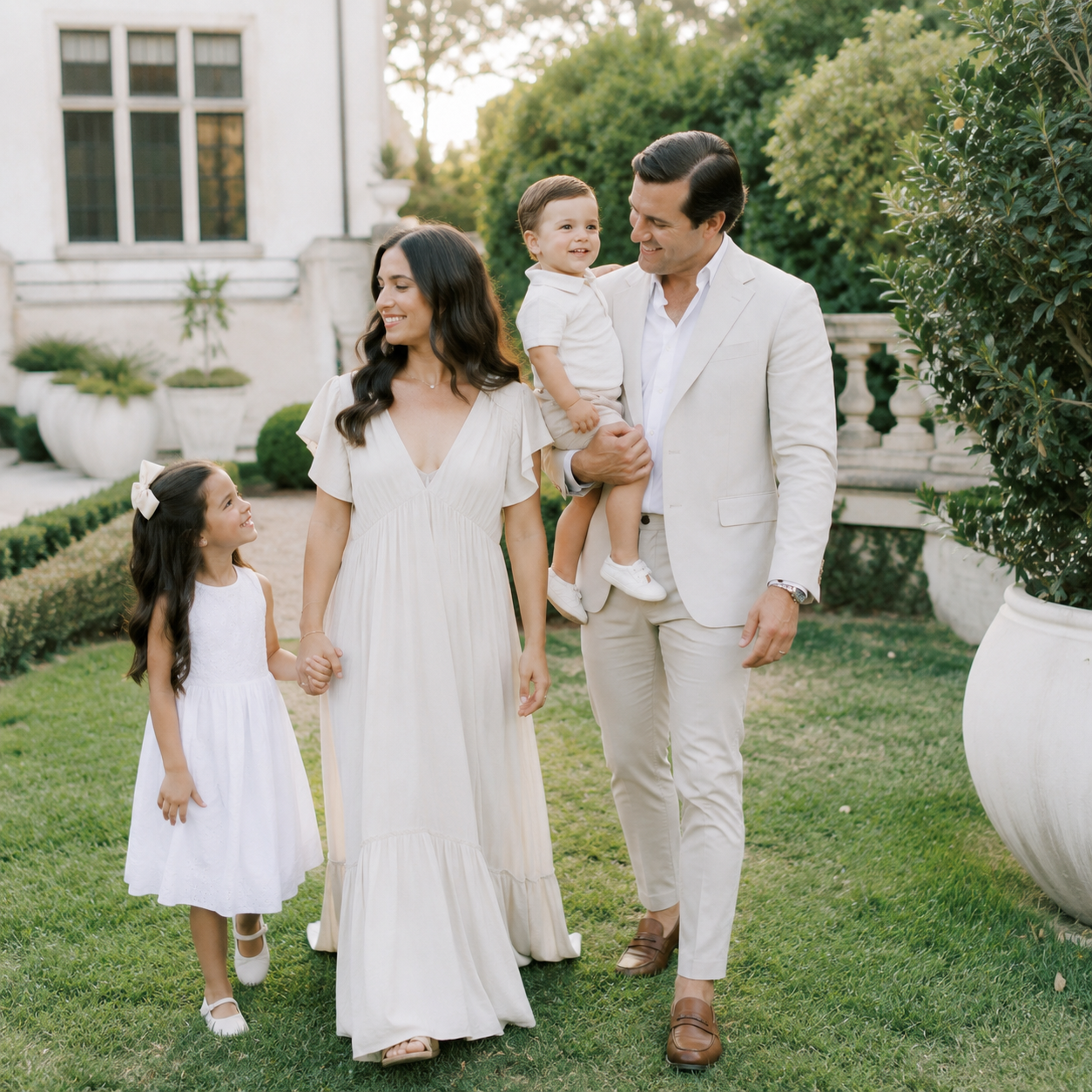 Family of four enjoying a relaxed luxury portrait session at Commodore Perry in Austin, Texas.