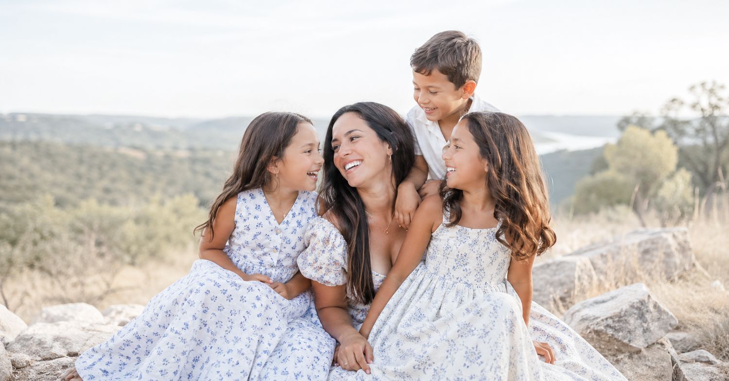Mother and children sharing joyful moments during a luxury family photography session in Austin, Texas.