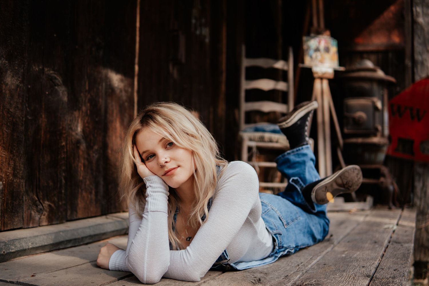 Casual portrait on wooden deck with rustic barn wood background.