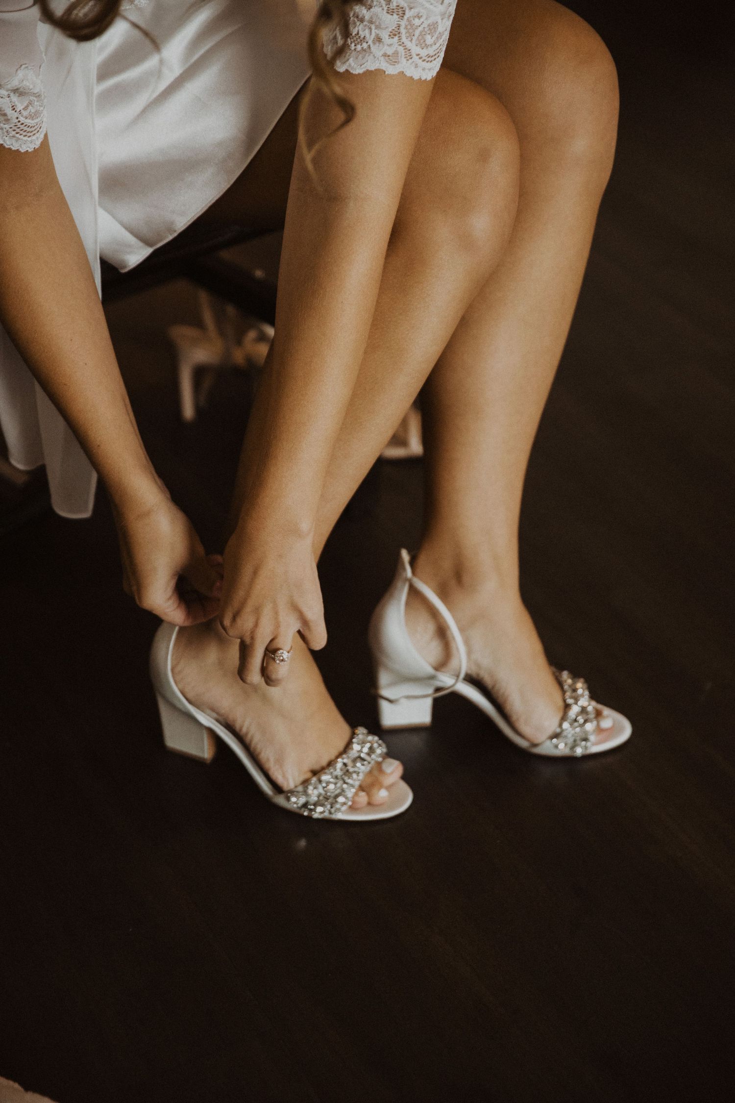 Close-up of elegant bridal shoes with crystal embellishments.