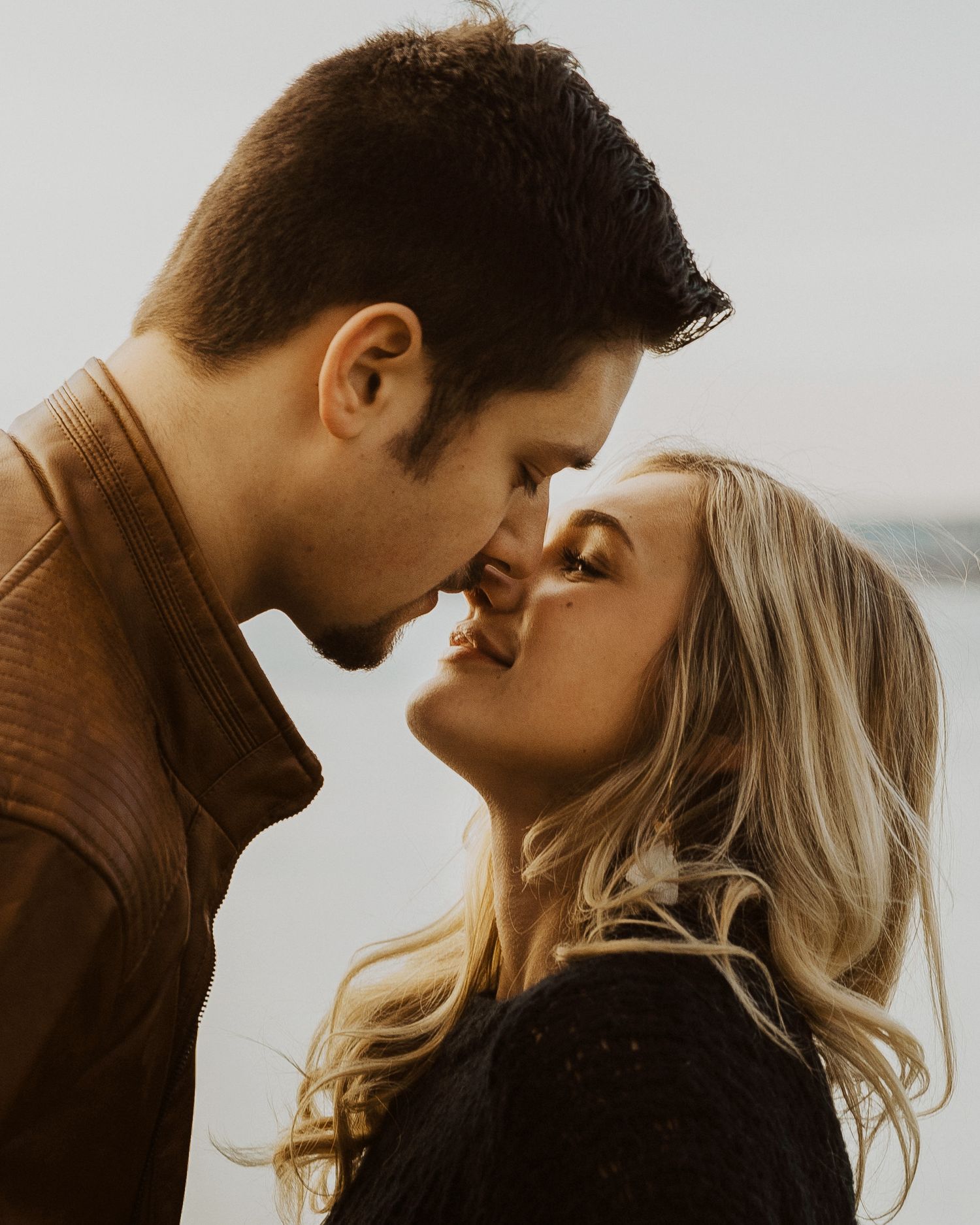 A romantic photo sequence showing tender moments between a couple in golden light.