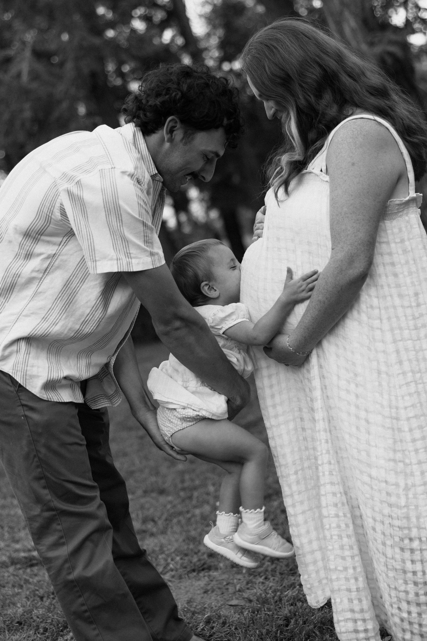 Playful interaction between two people in black and white photography.