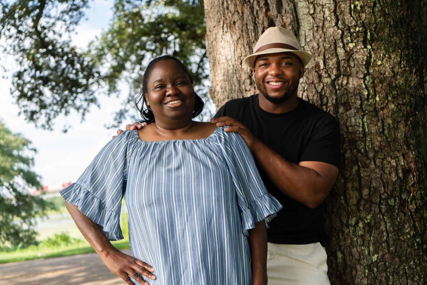 Casual outdoor portrait sequence against large tree trunk.