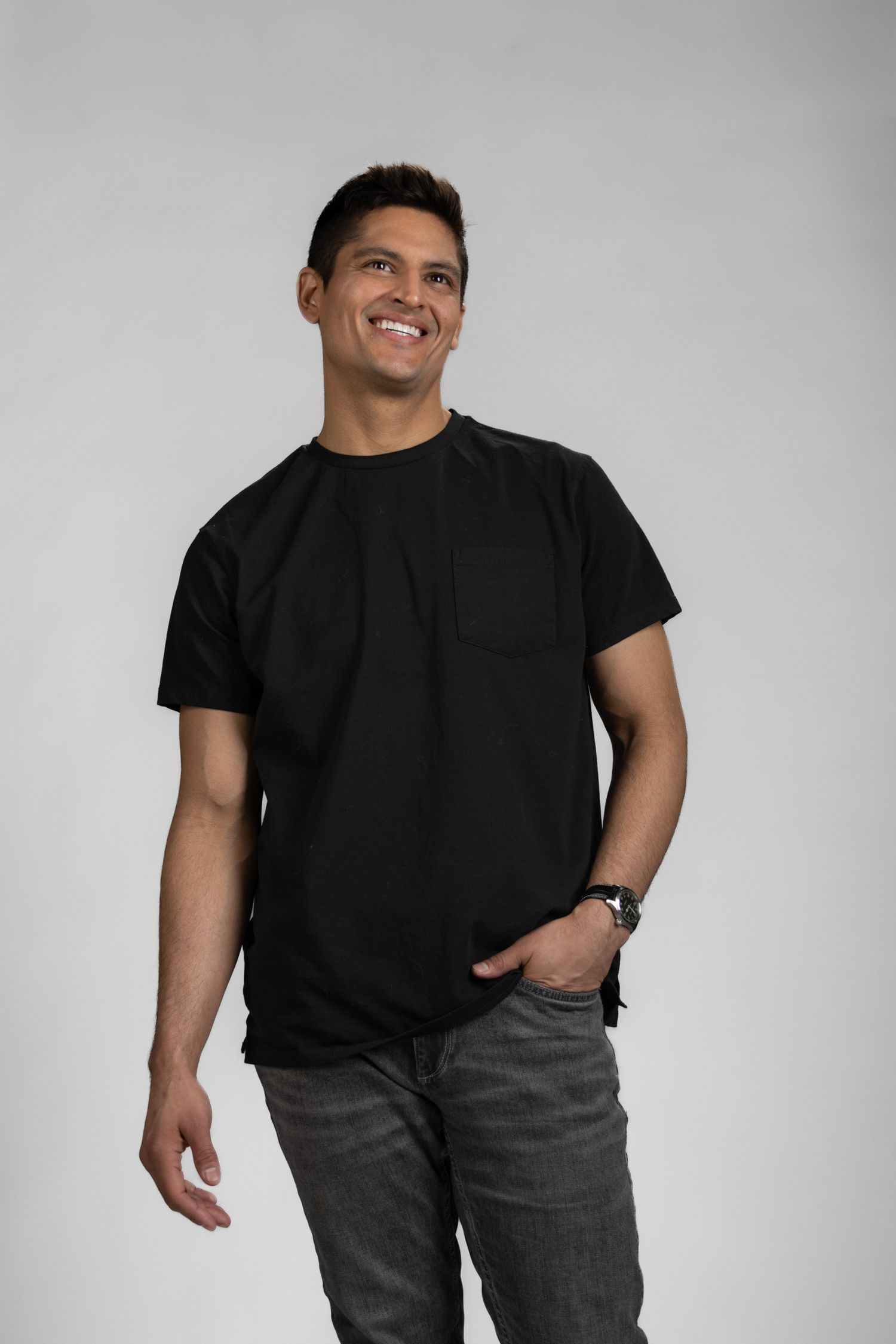Male model stood in front of white seamless background