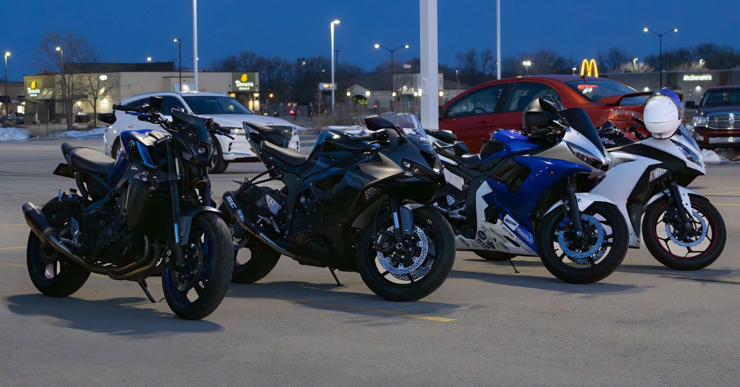 Four sport bikes lined up in parking lot