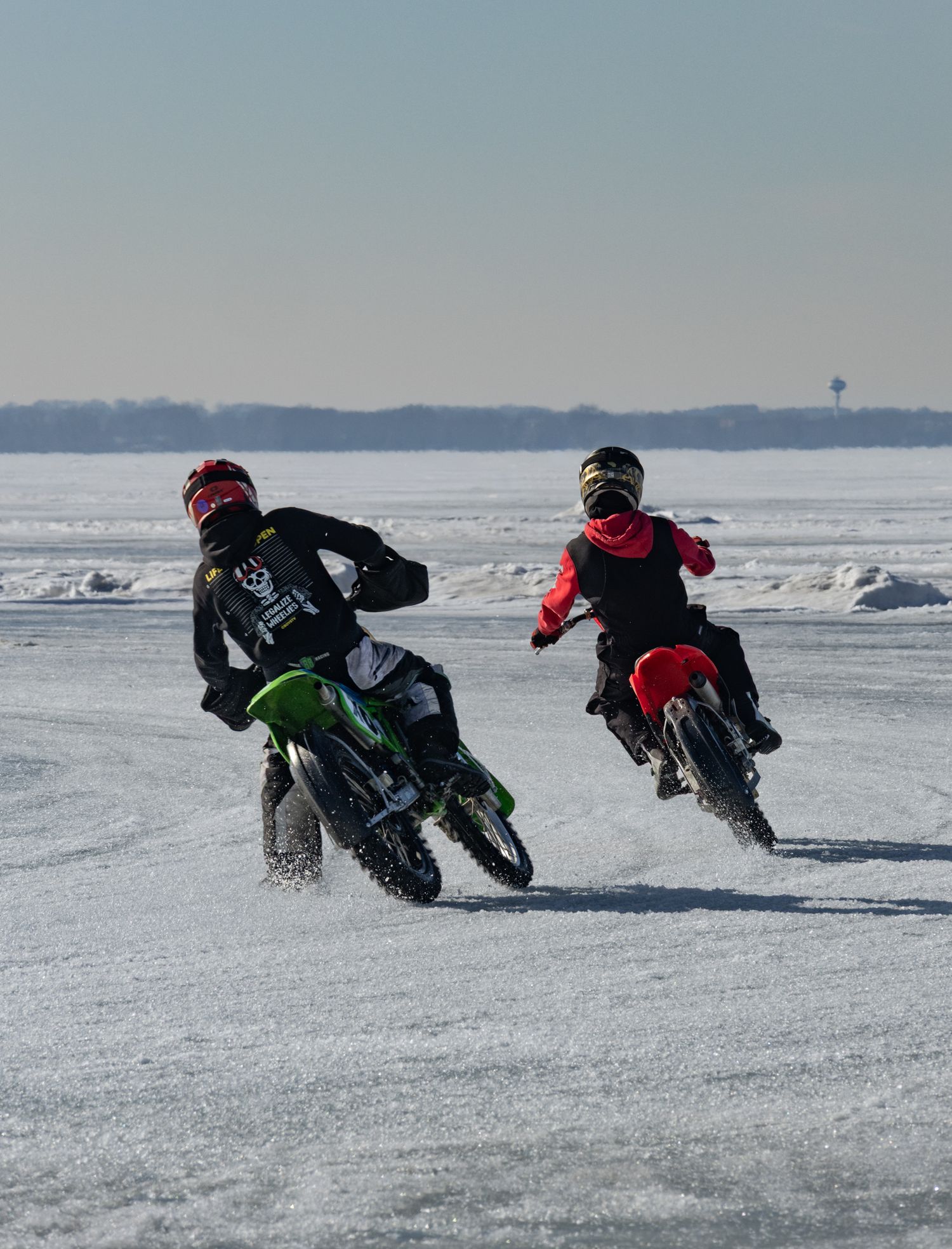 Dirt bikes racing on frozen lake