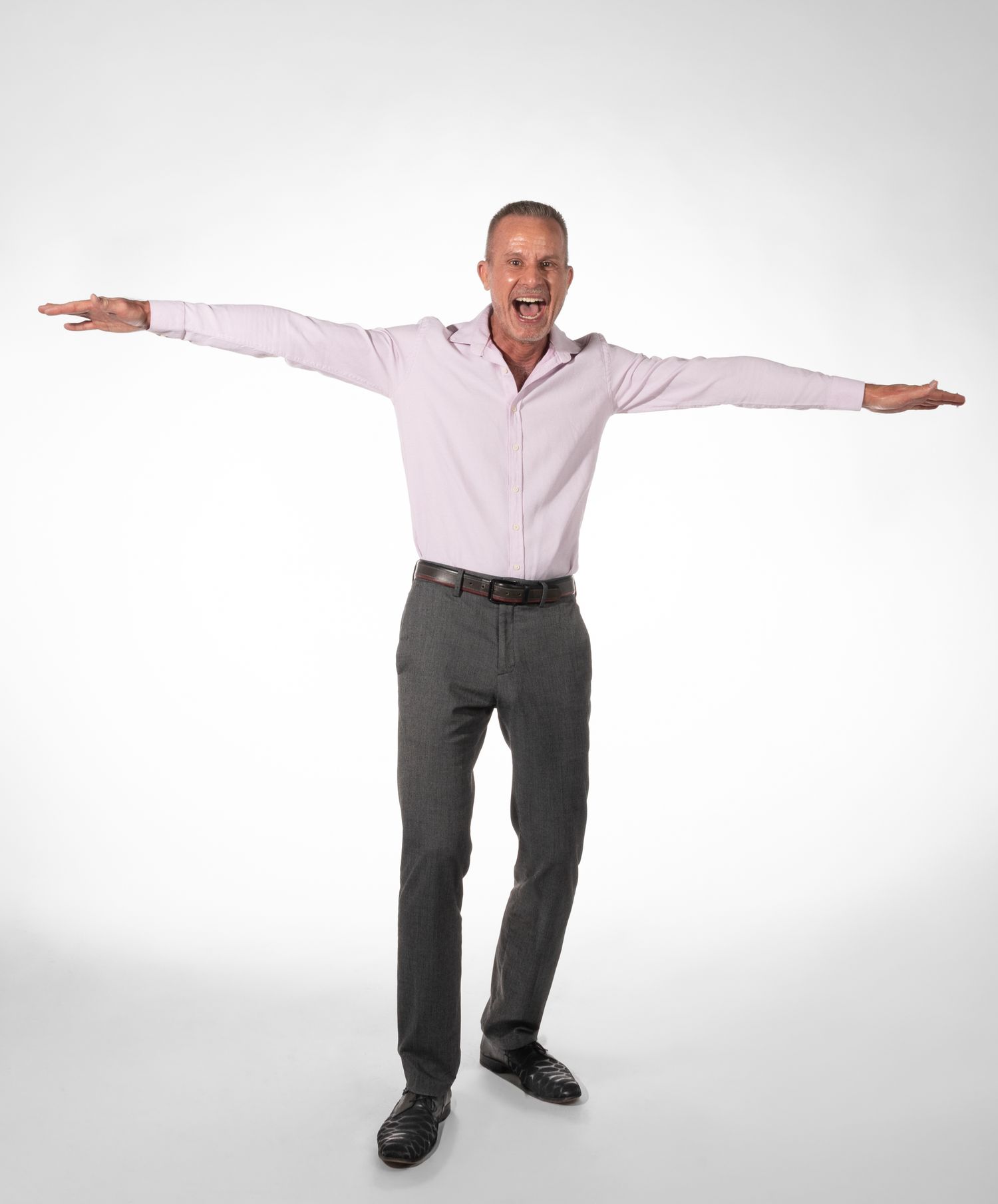 Male model posed in front of white seamless background