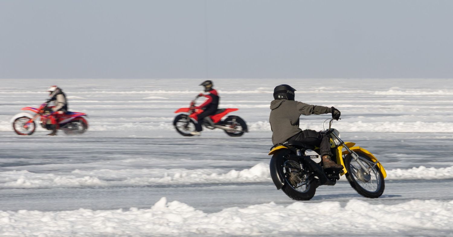 Dirt bikes racing on frozen lake