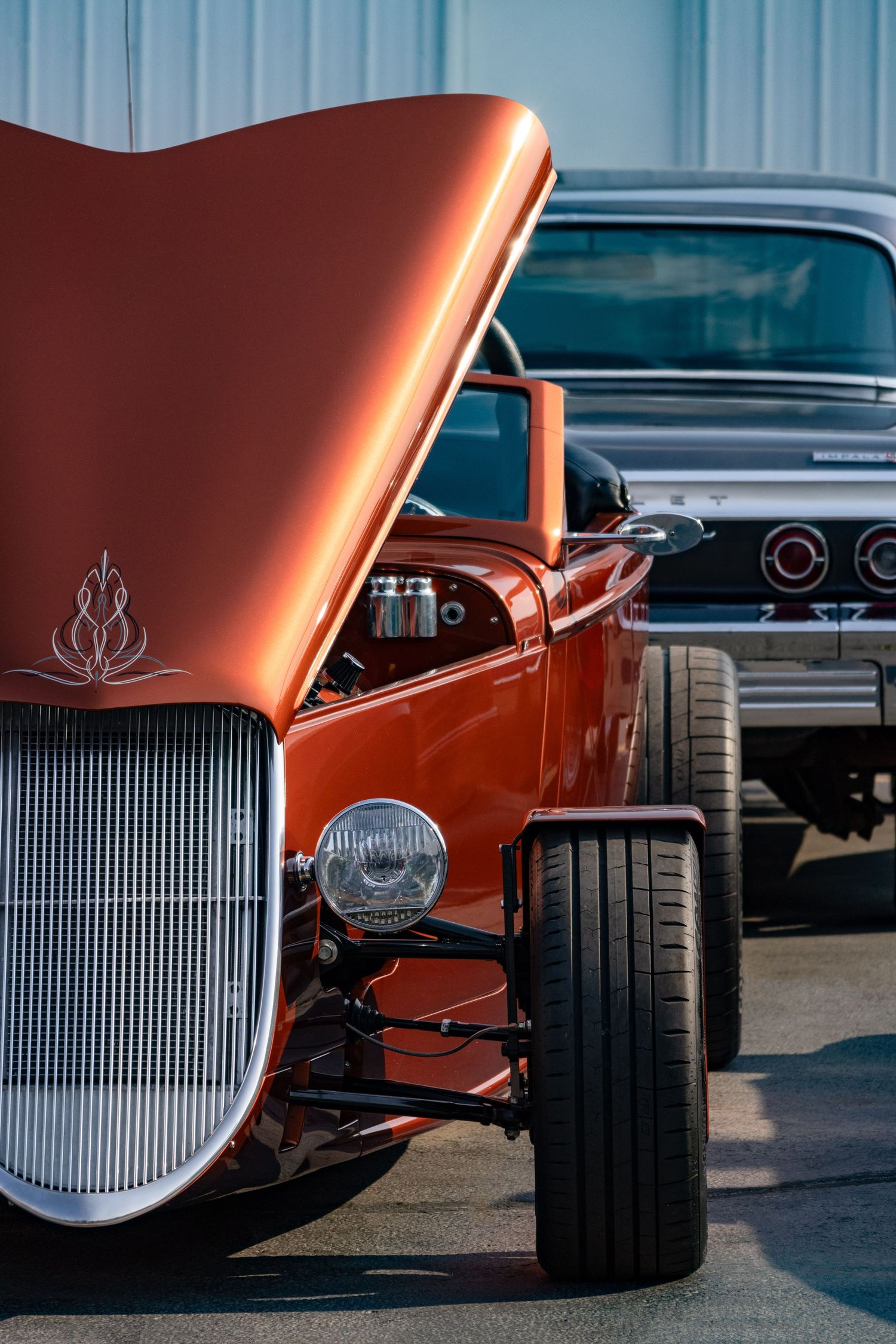 1930s orange Ford Roadster with hood open