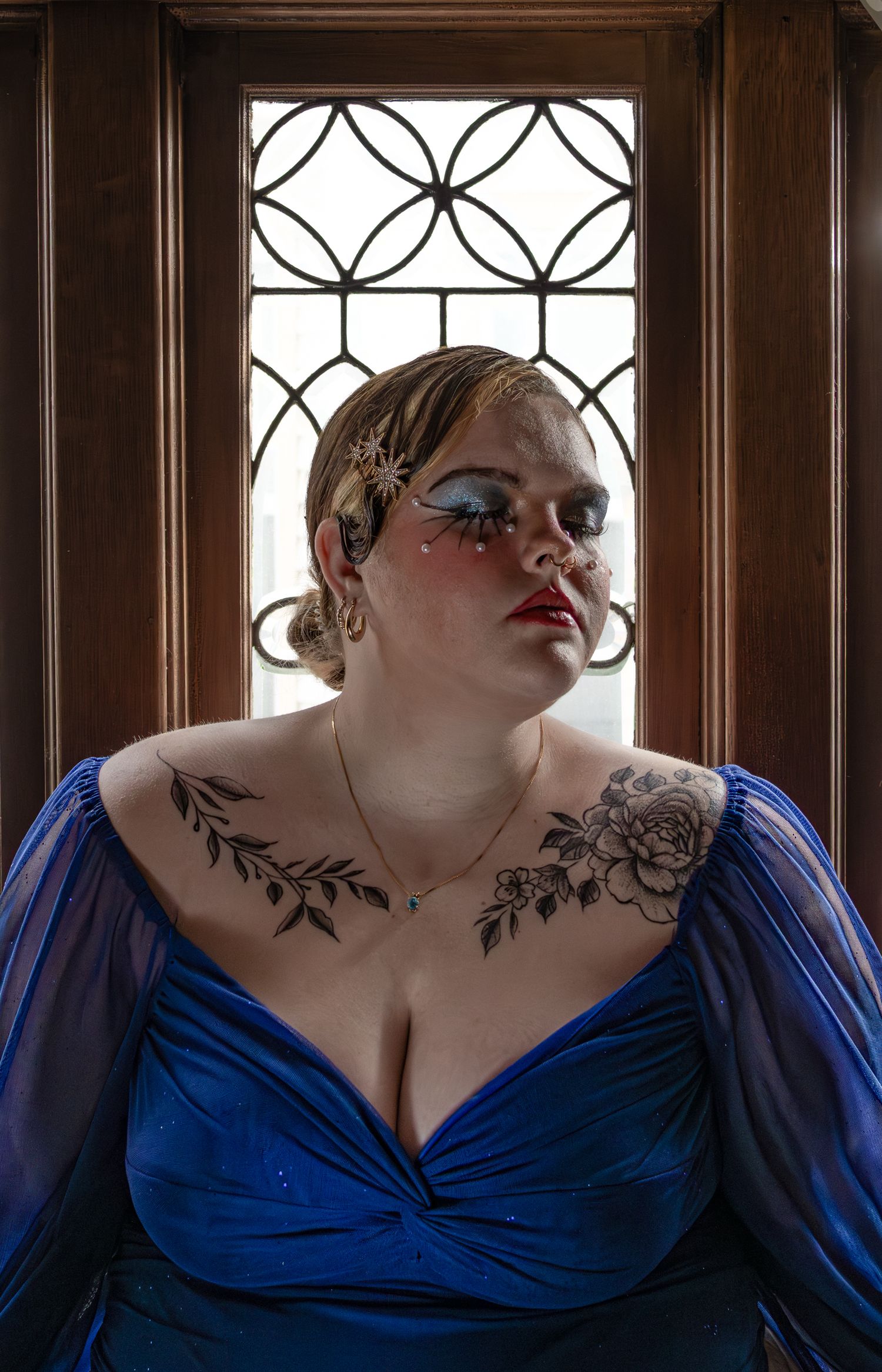 Female model portrait in front of glass window