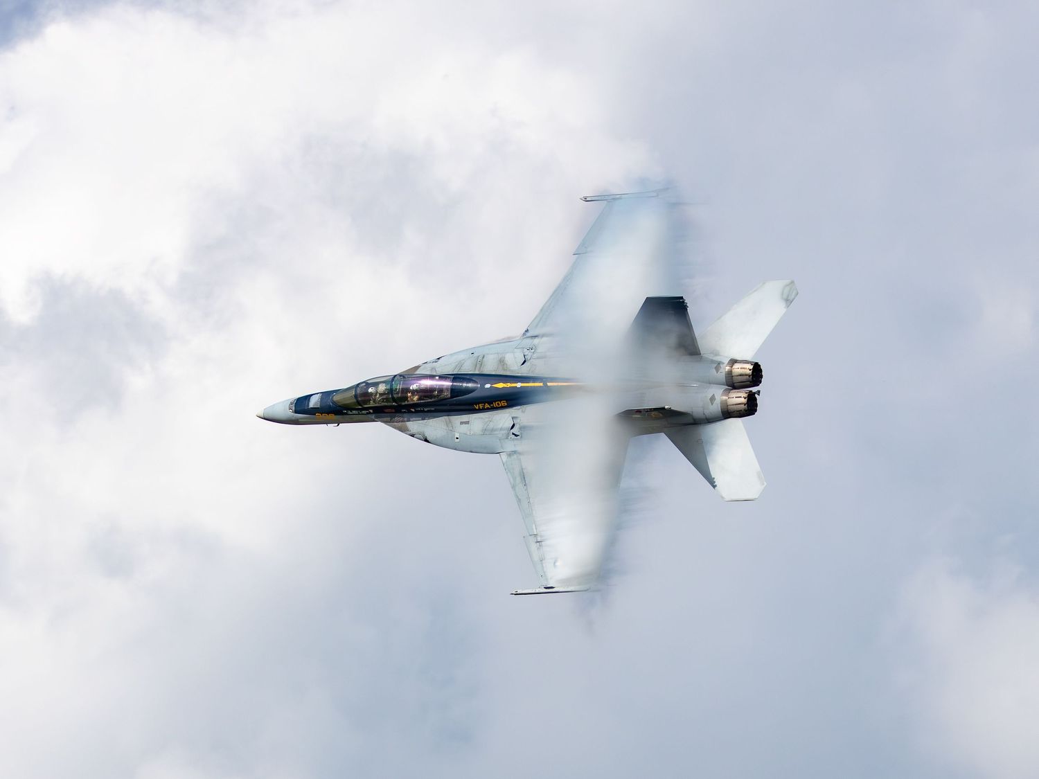 F-18 flying with vapor cone
