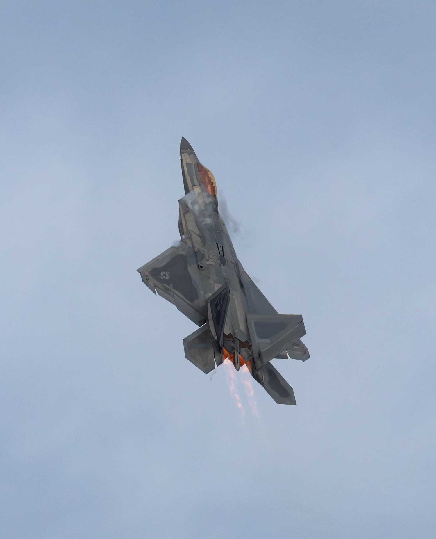 F-22 Raptor flying vertical with afterburner