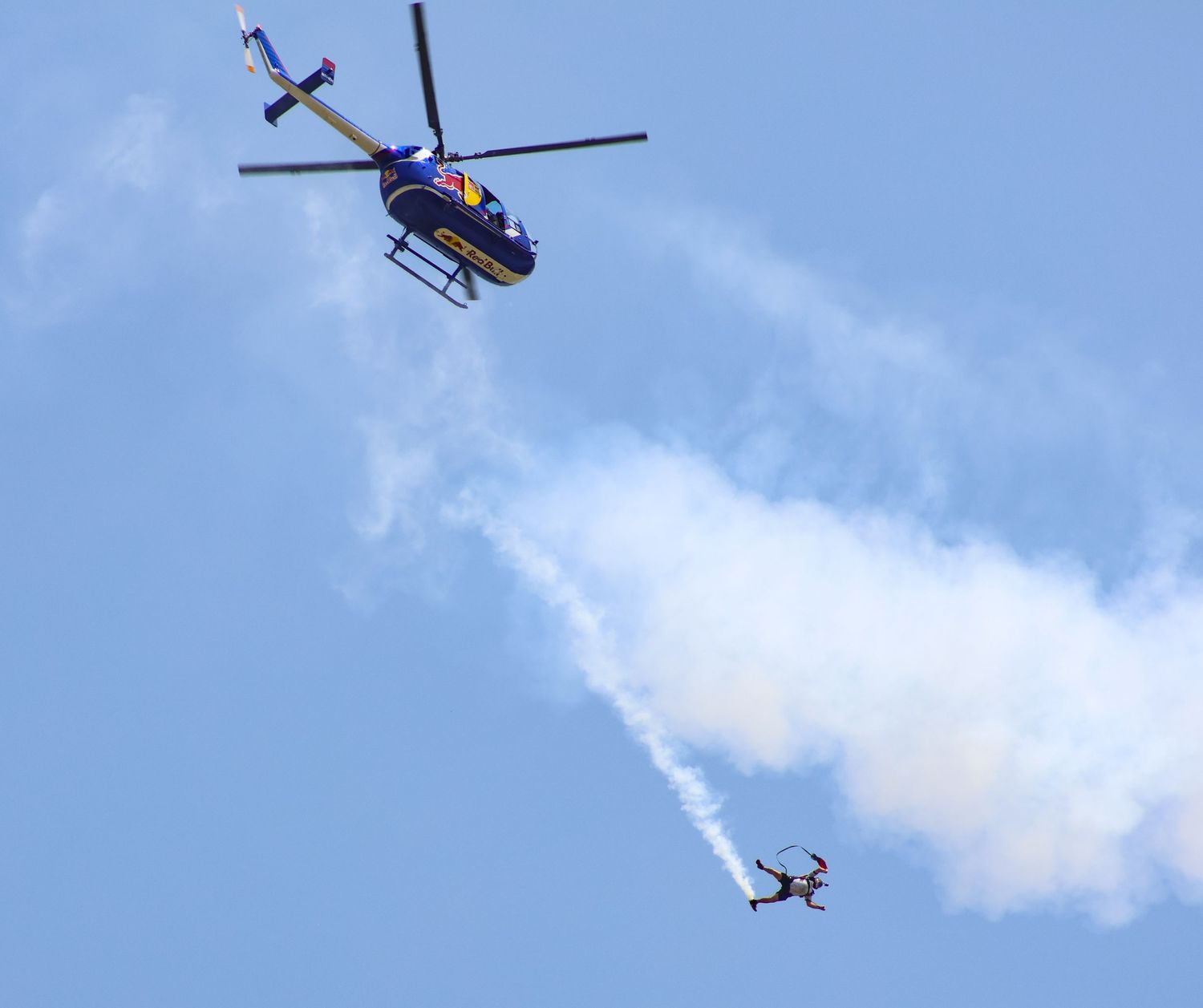 Skydiver falling from Red Bull Air Force helicopter