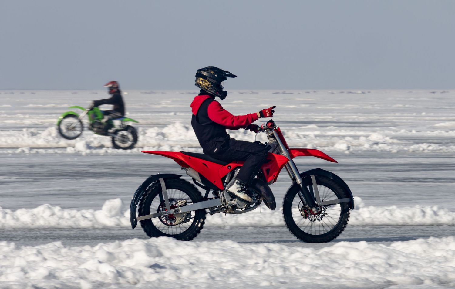 Dirt bikes racing on frozen lake