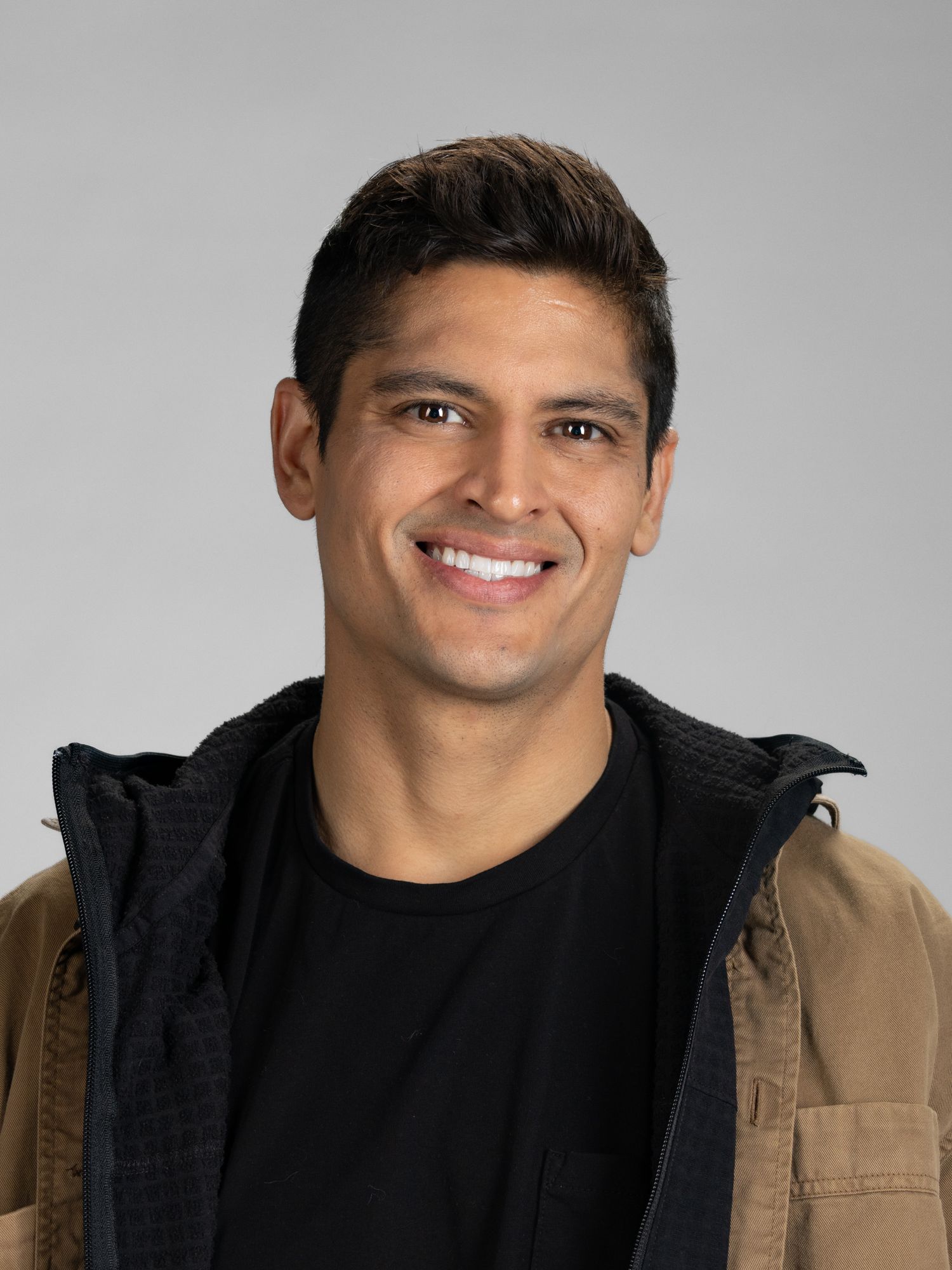 Male model headshot in front of white background