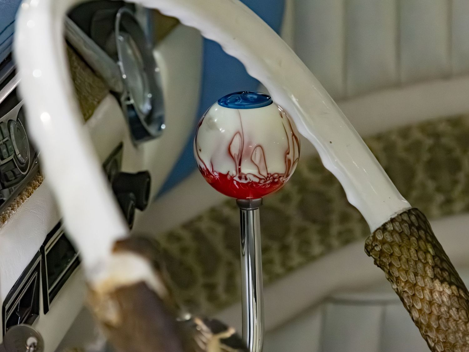 Eyeball gear shift in white car with snakeskin accents