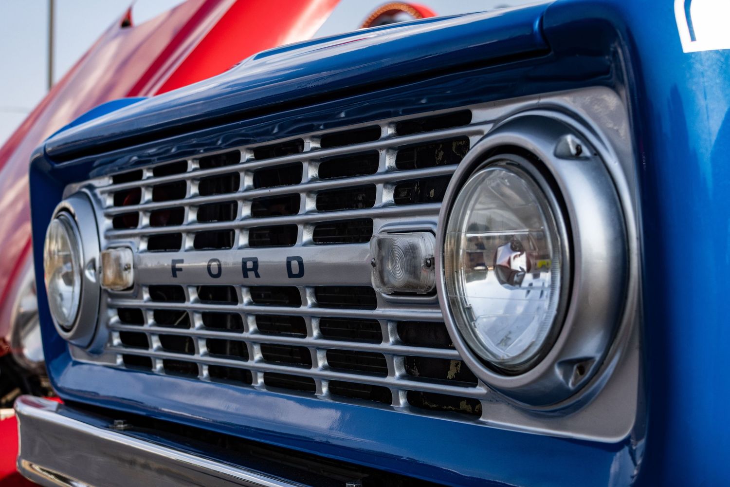 First generation blue Ford Bronco lights and grill close up