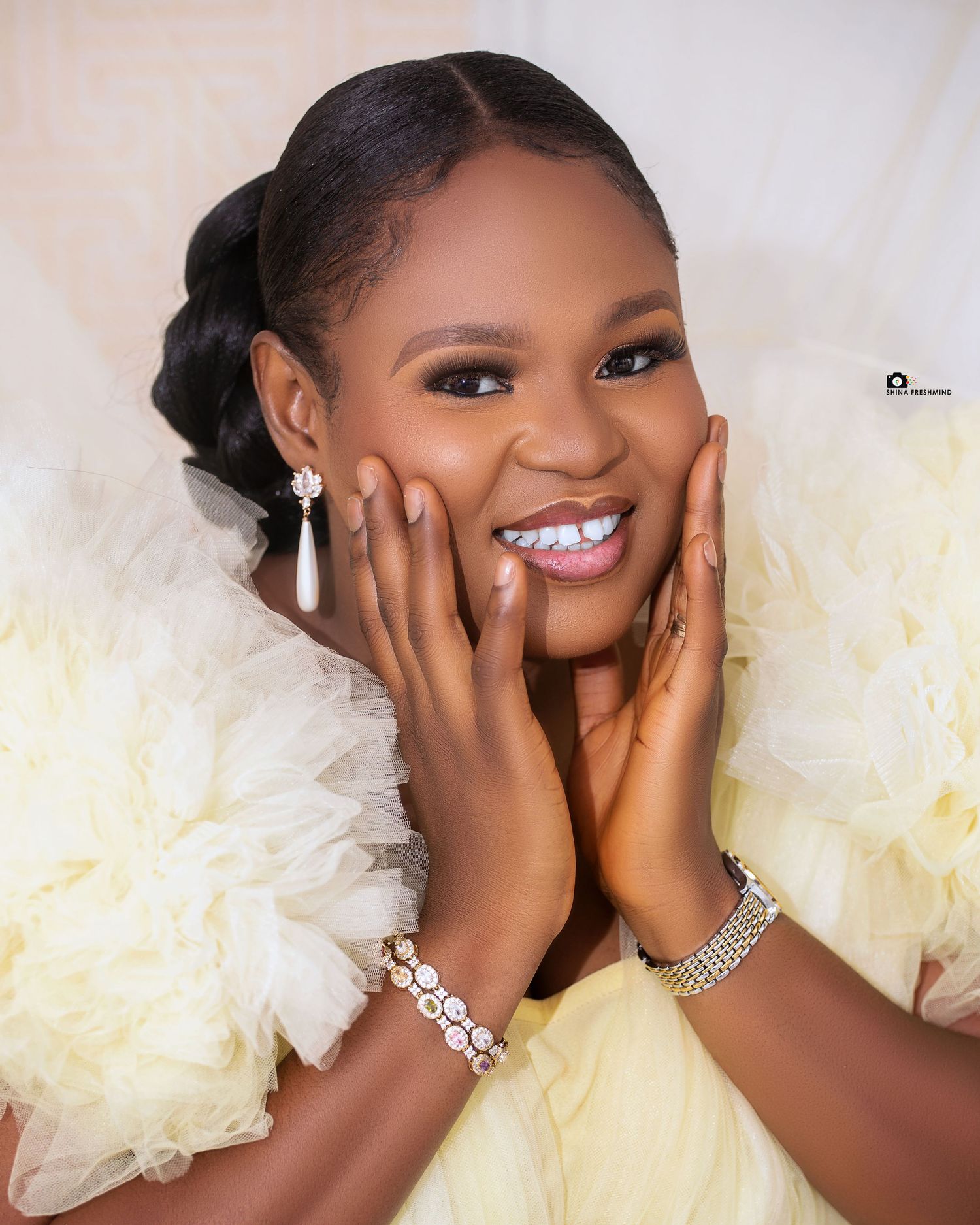 A bridal portrait series showing joyful expressions against a light background with elegant makeup and accessories.