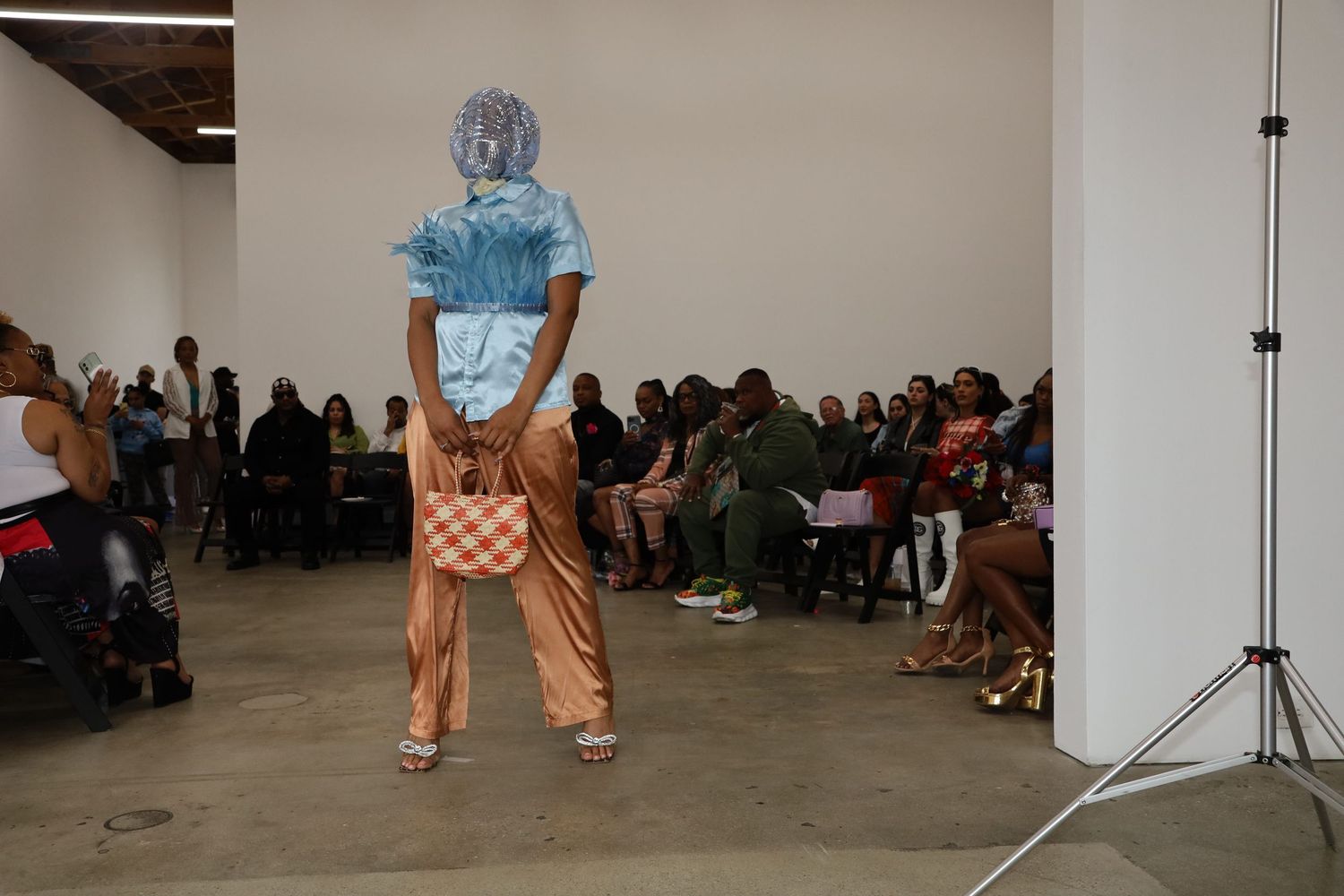 Fashion presentation features casual summer look with checkered bottoms.