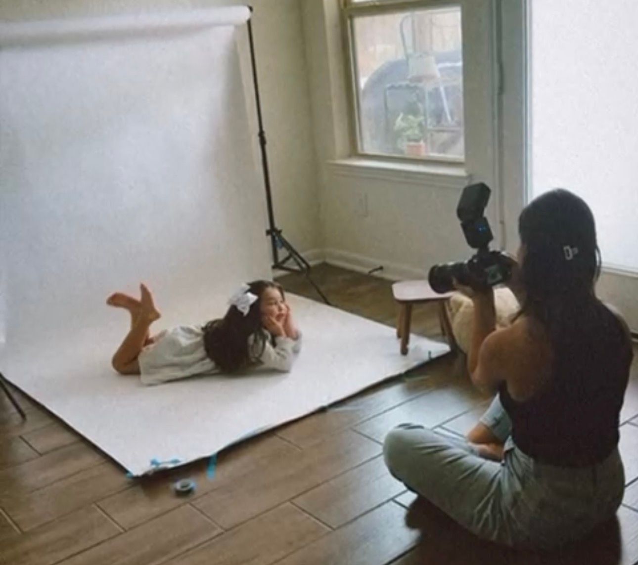 A sequence of photos showing someone sitting in an empty room against a white wall.