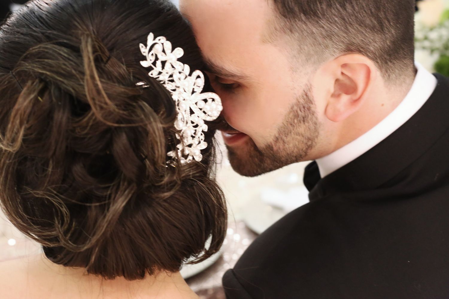 Romantic wedding photography series showing close-up details of a couple's intimate moments during their celebration.