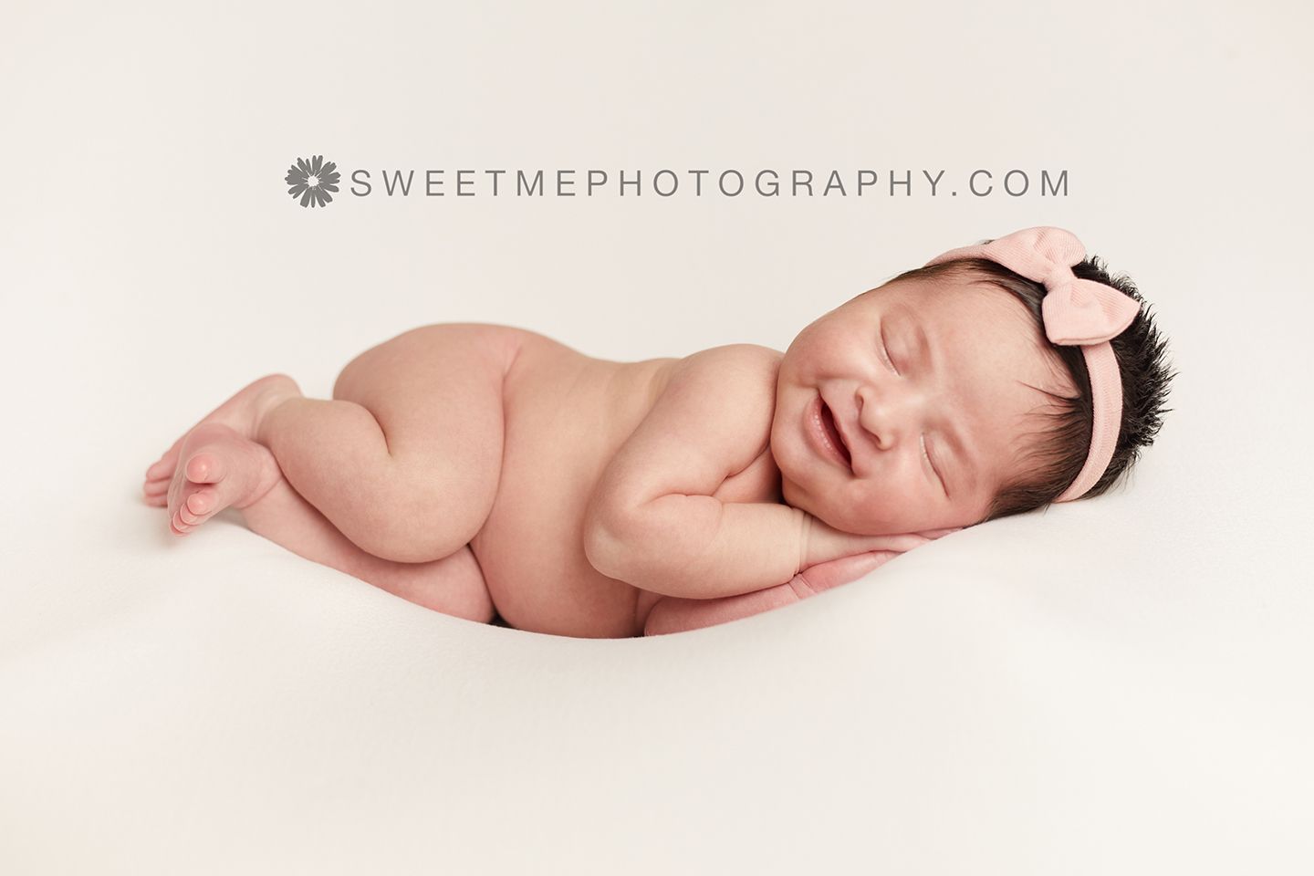 Artistic newborn photo series featuring peaceful sleeping baby in minimalist white setting.