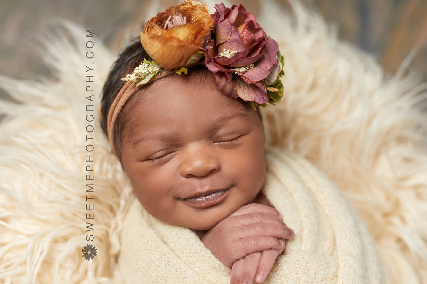Artistic newborn photography series featuring floral headpieces and soft furry backdrop.
