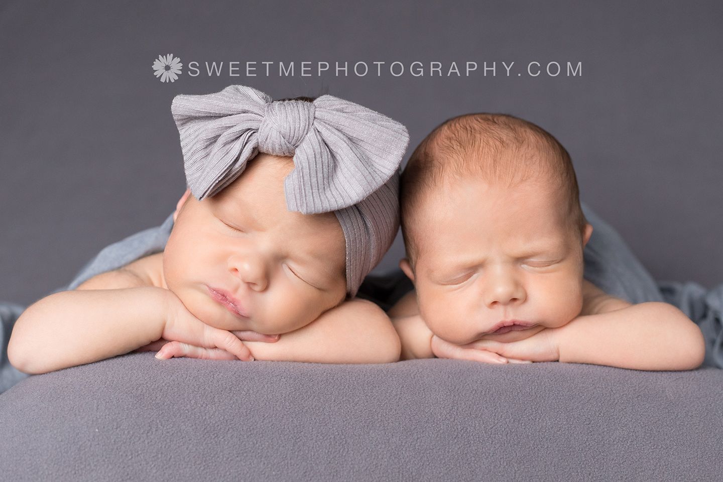 Series of artistic black and white newborn portraits showing peaceful sleeping poses on soft fabric.
