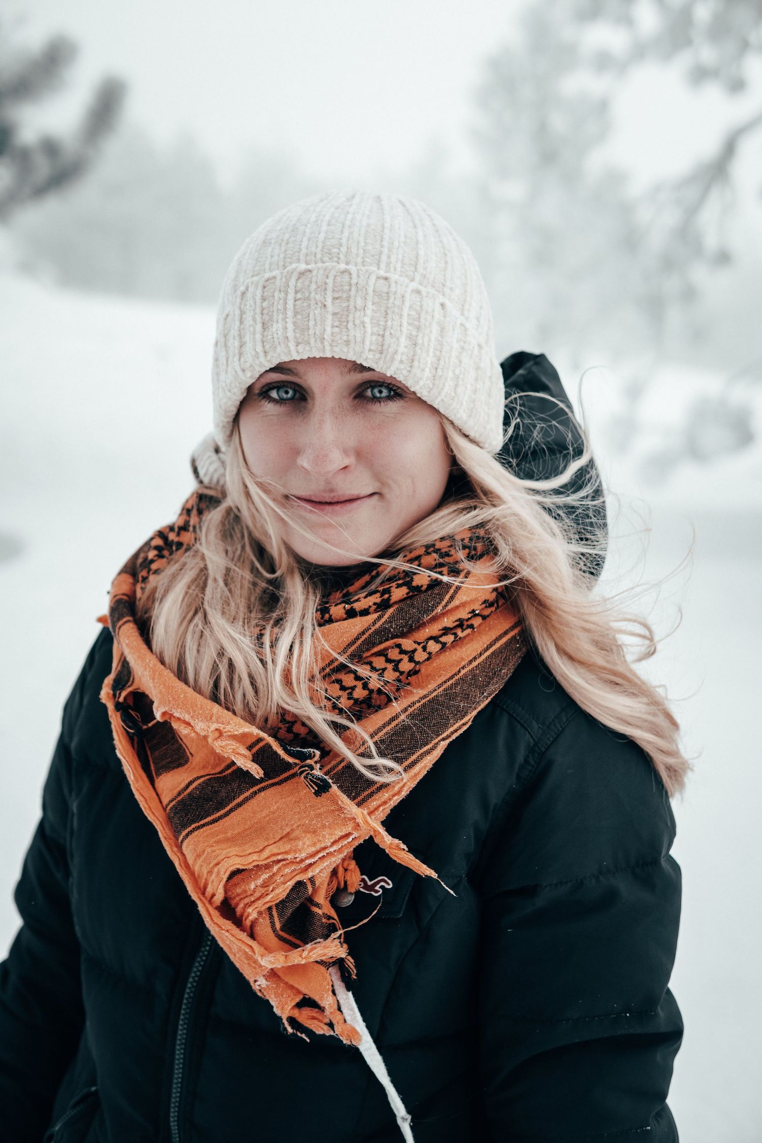 Solo portrait of a woman in Breckenridge, Colorado with mountain views and golden-hour light.