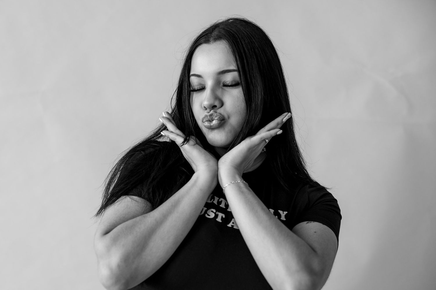 A black and white photo series showing a person expressing different emotional states and gestures.