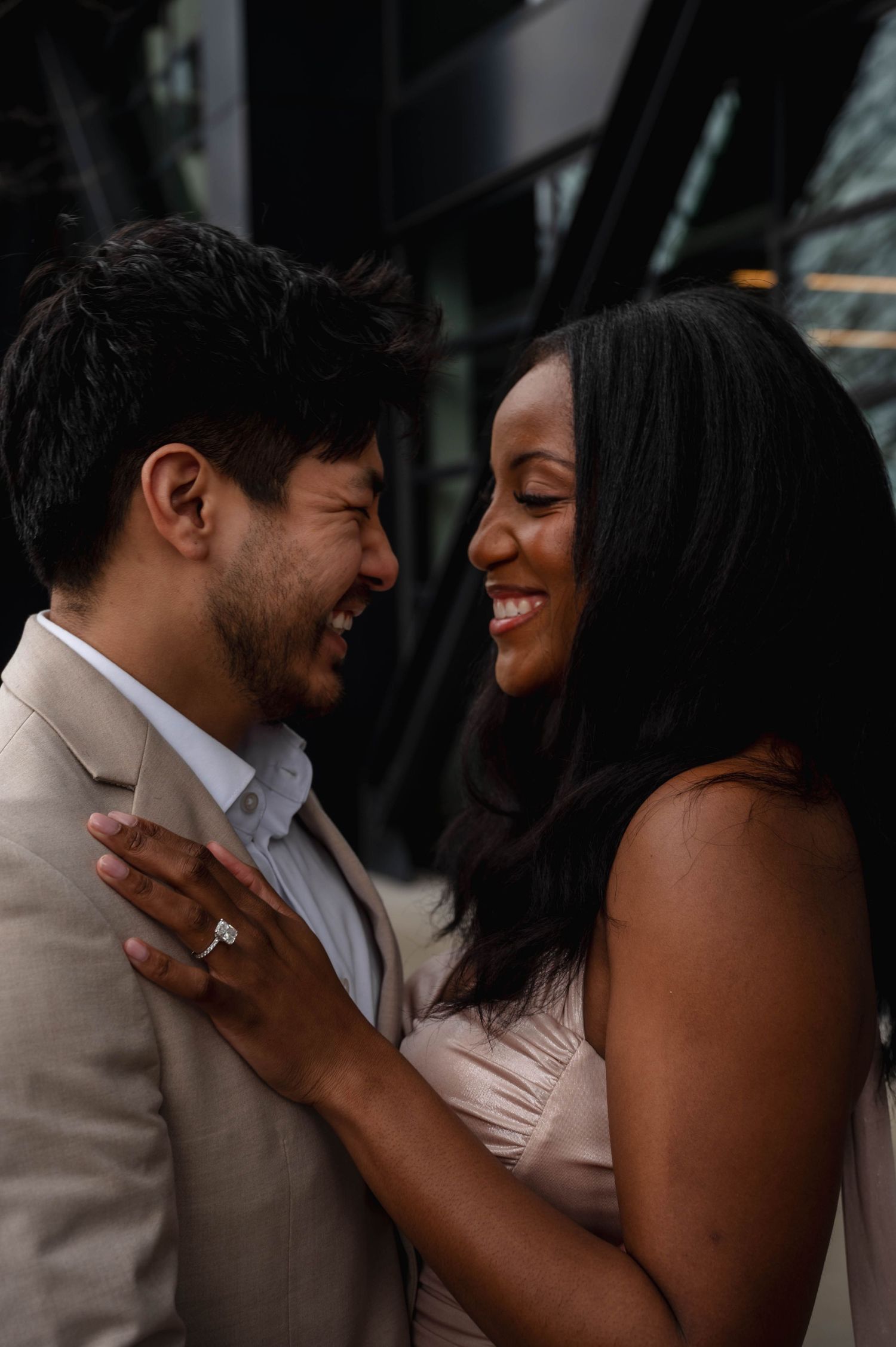 A romantic couple shares intimate moments in a series of candid engagement photos with natural lighting.