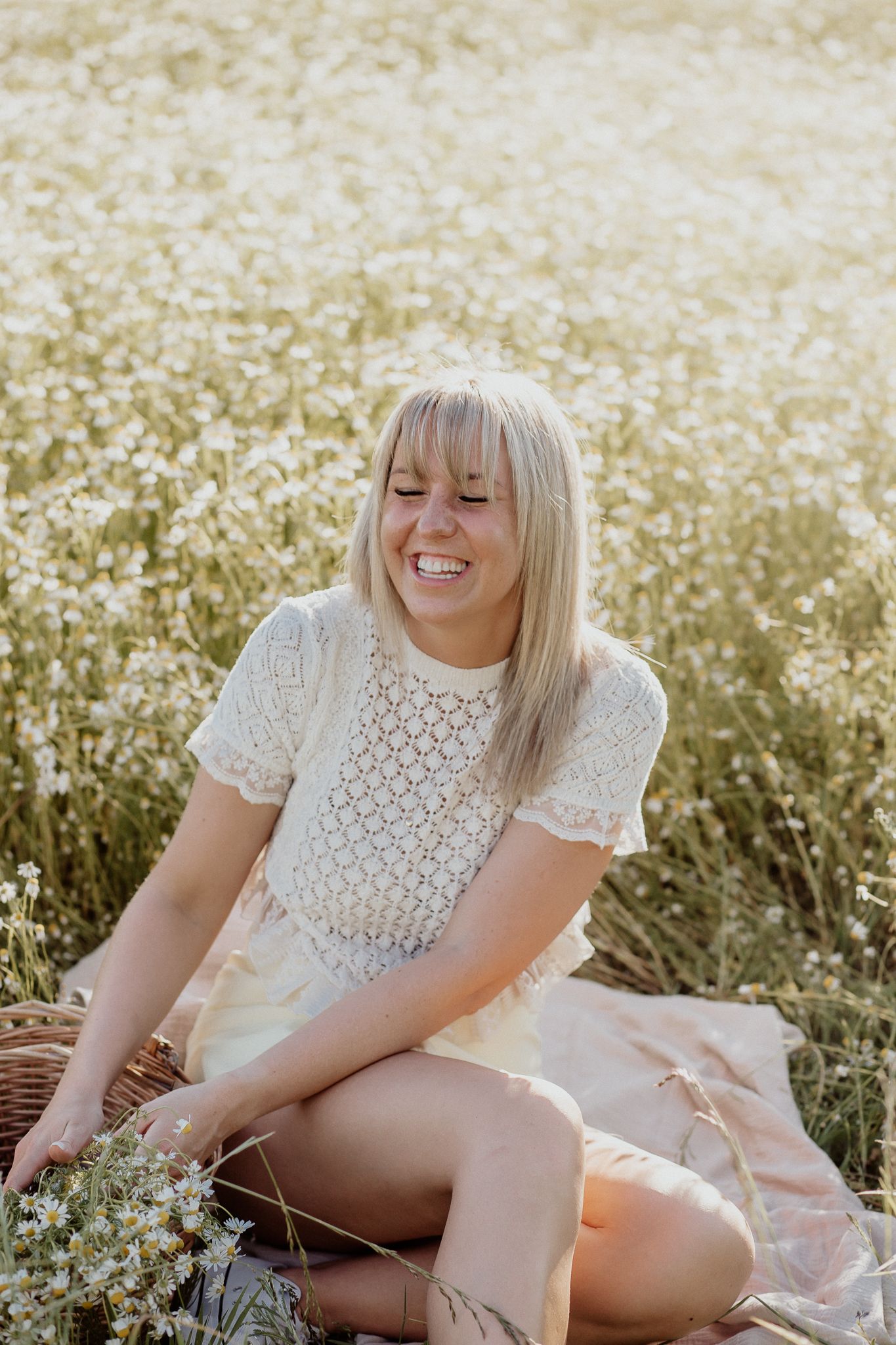 Natural lifestyle portrait of a woman in soft outdoor light, capturing authentic personality and emotion.