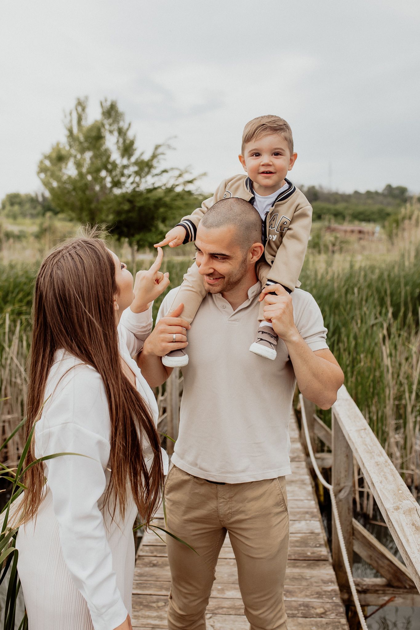Emotional portrait showing a gentle hand touch between family members during a relaxed photography session.