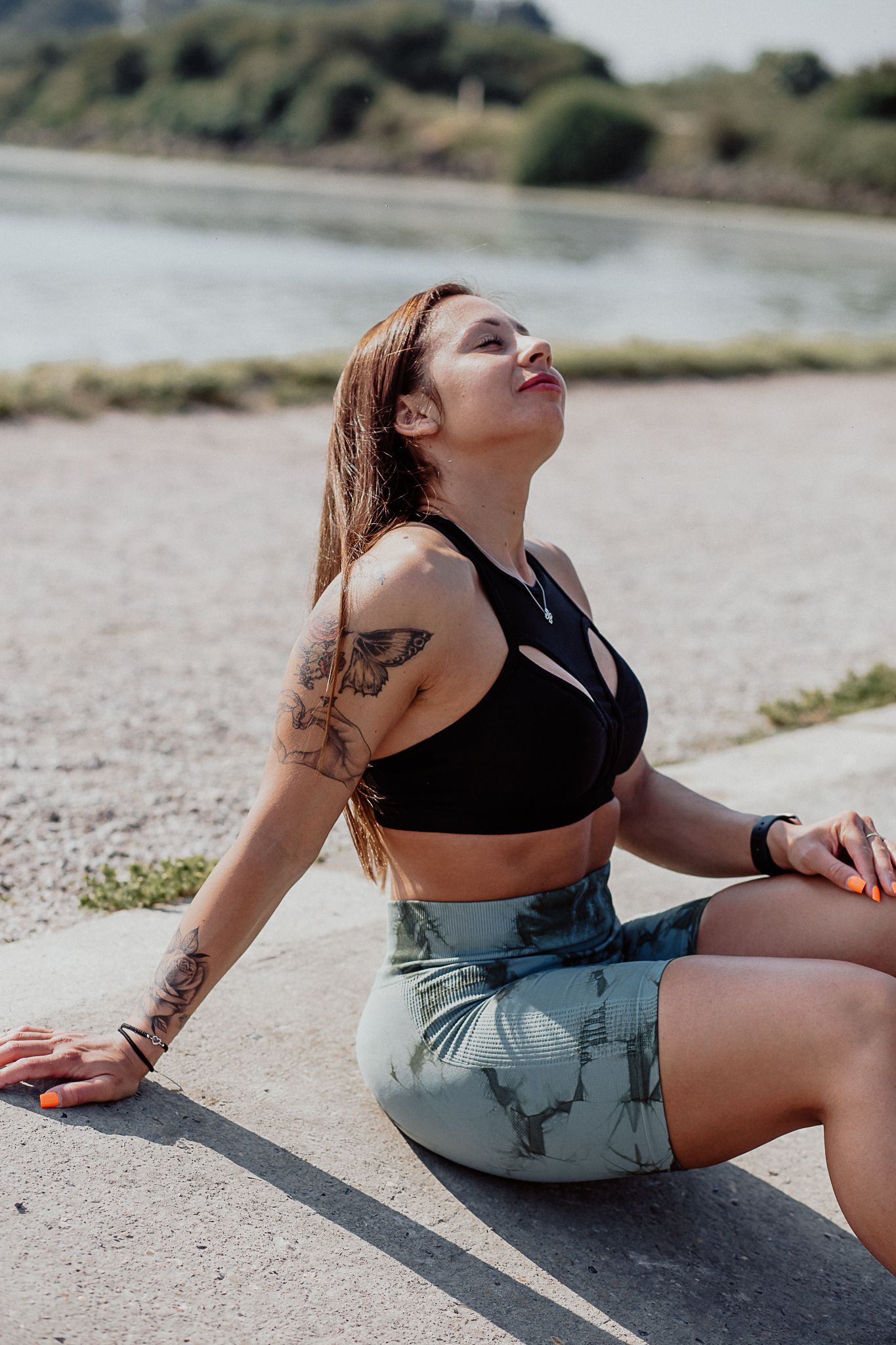 Natural lifestyle portrait of a woman in soft outdoor light, capturing authentic personality and emotion.
