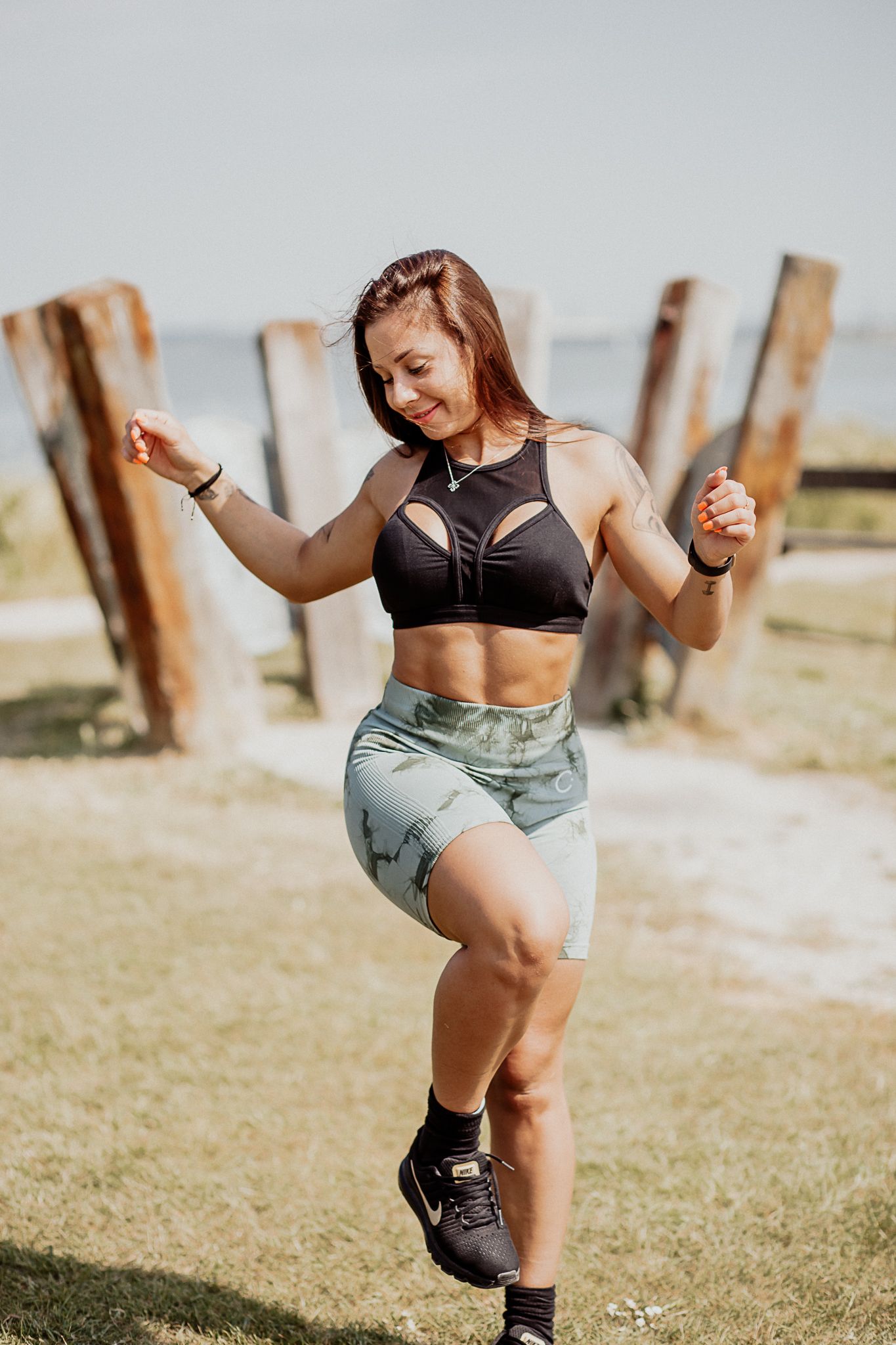 Natural lifestyle portrait of a woman in soft outdoor light, capturing authentic personality and emotion.