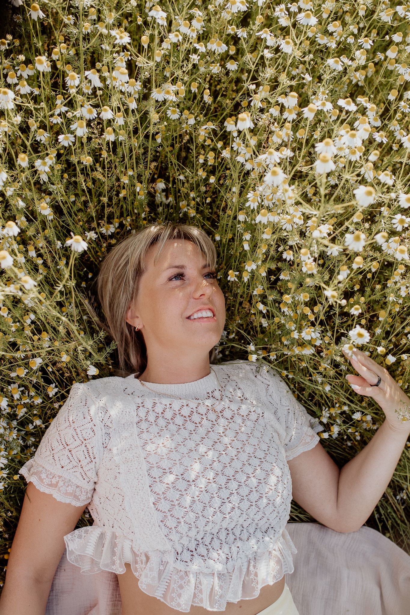 Natural lifestyle portrait of a woman in soft outdoor light, capturing authentic personality and emotion.