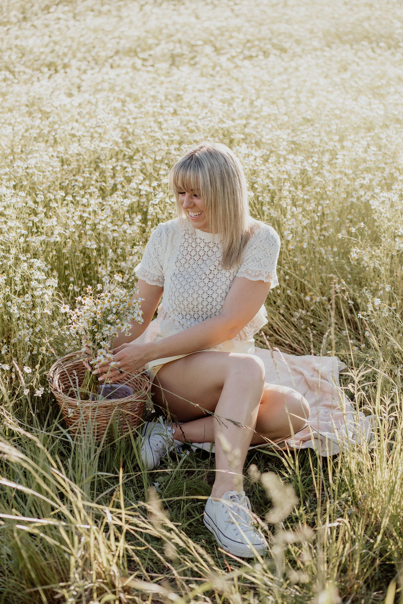 Natural lifestyle portrait of a woman in soft outdoor light, capturing authentic personality and emotion.