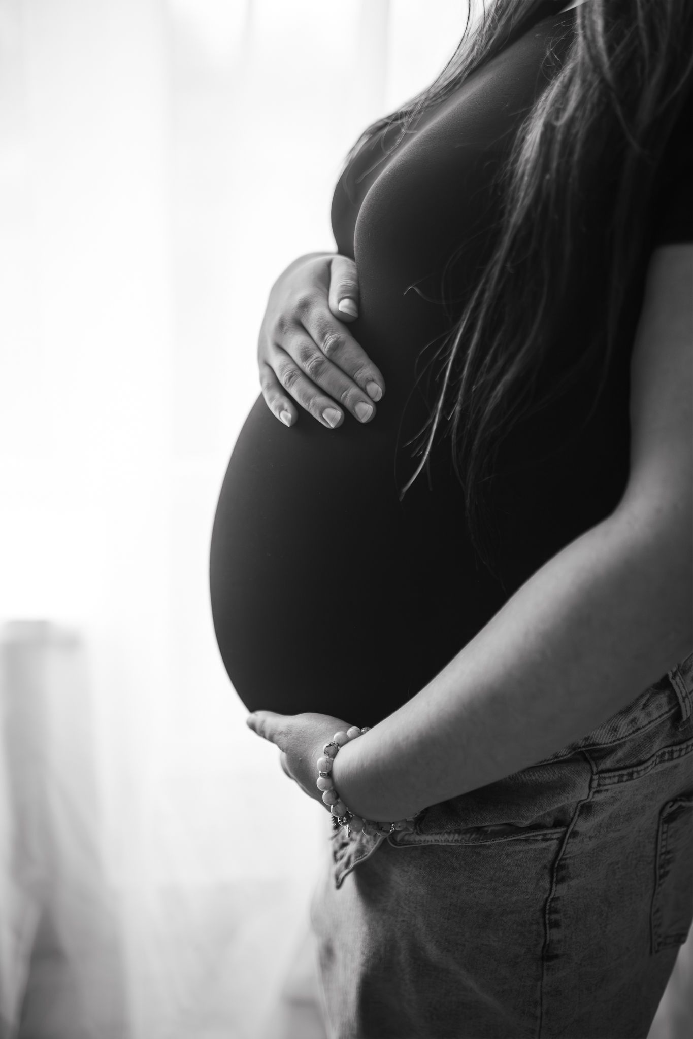 photo of baby bump during indoor maternity shoot in Latvia