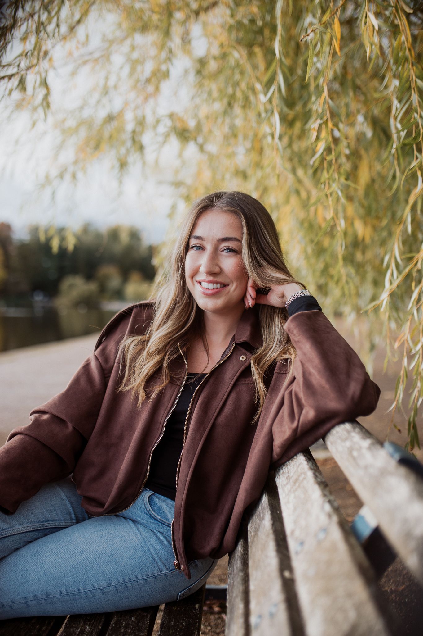 Natural lifestyle portrait of a woman in soft outdoor light, capturing authentic personality and emotion.