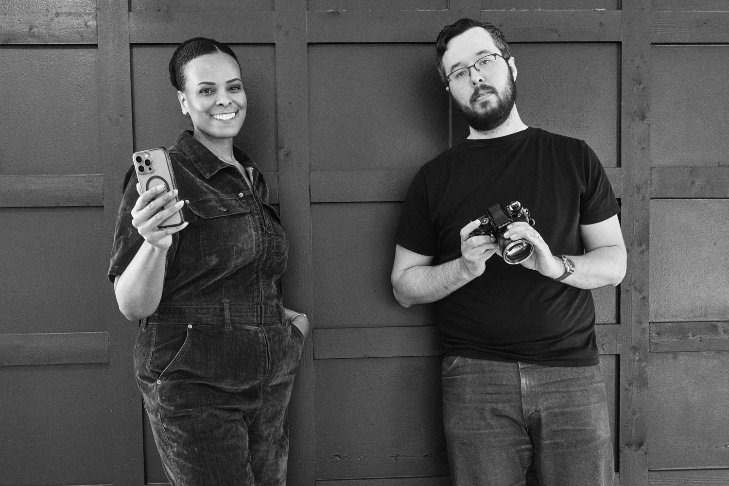 Two people in black t-shirts demonstrate a series of casual poses against a gray wall in a photo sequence.